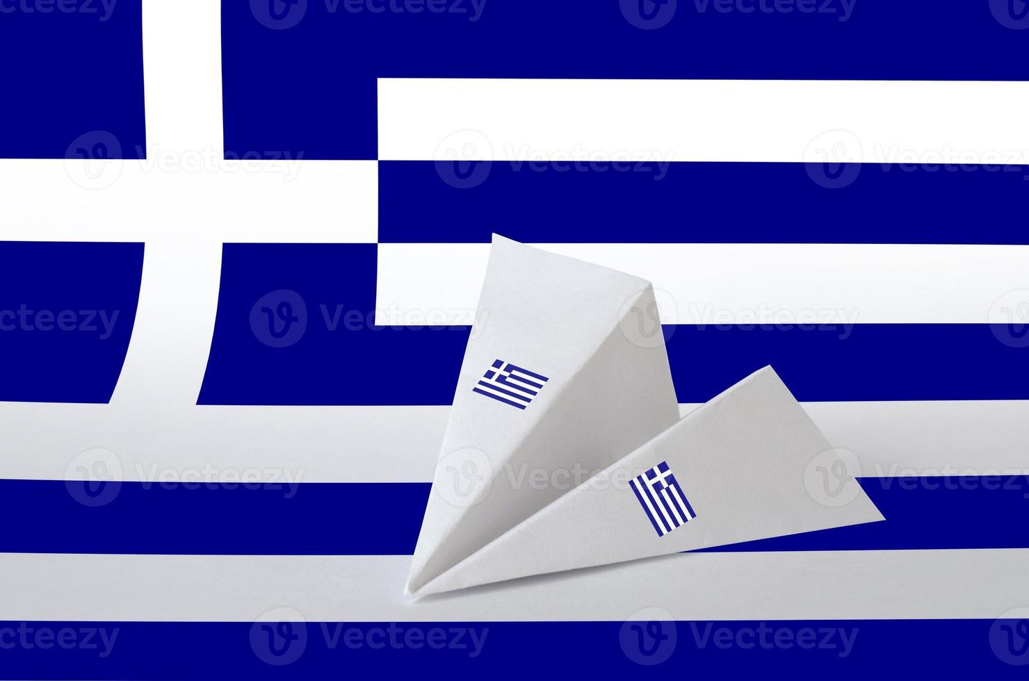 Greece flag depicted on paper origami airplane. Handmade arts concept photo