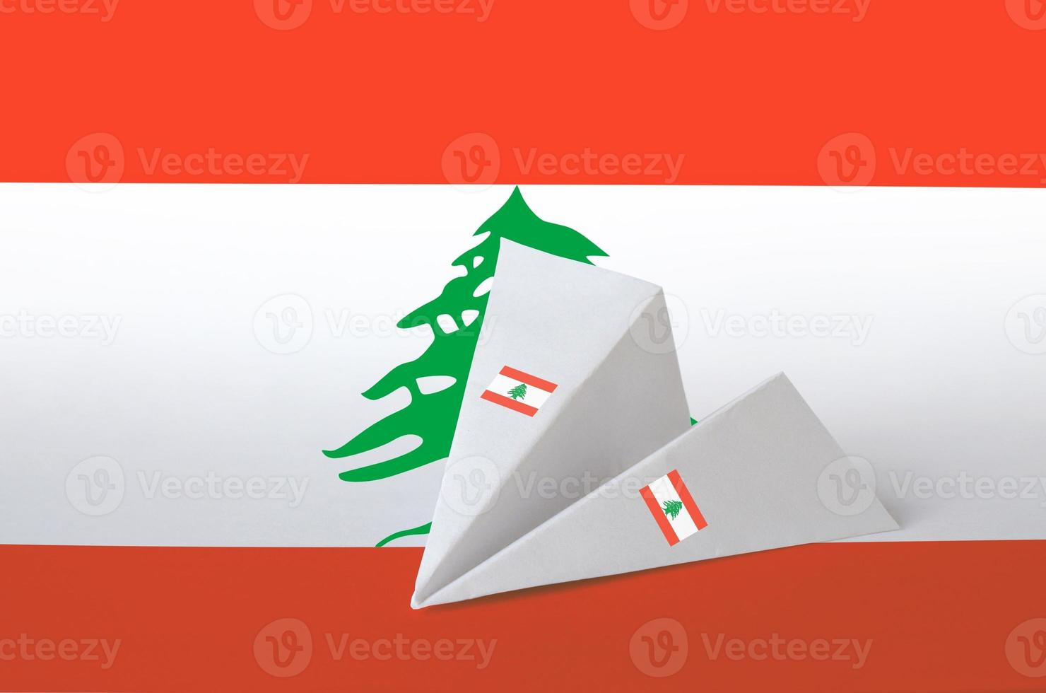 Lebanon flag depicted on paper origami airplane. Handmade arts concept photo