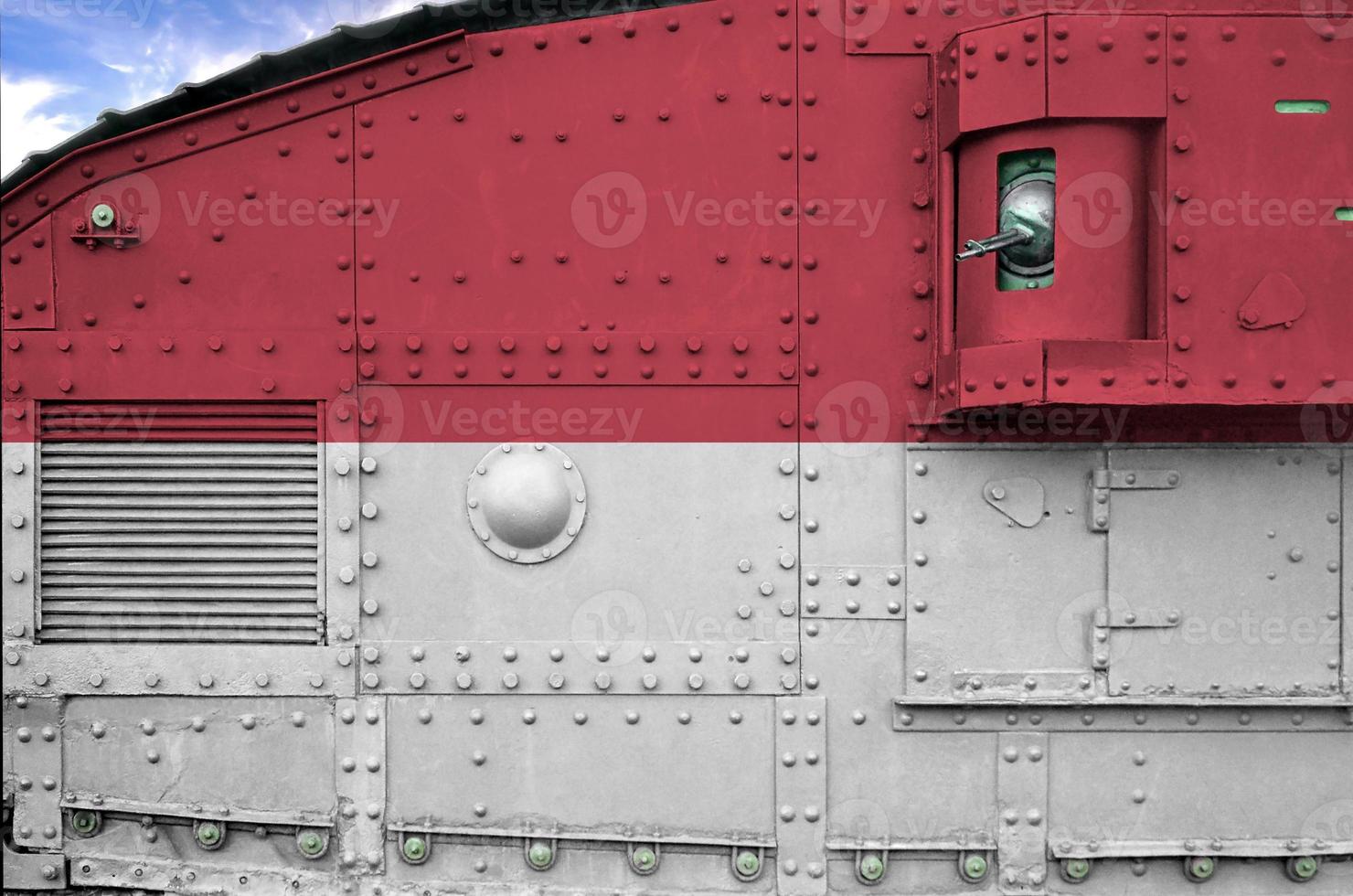 Monaco flag depicted on side part of military armored tank closeup. Army forces conceptual background photo