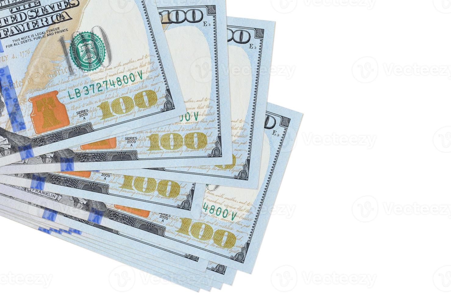 100 US dollars bills lies in small bunch or pack isolated on white. Mockup with copy space. Business and currency exchange photo