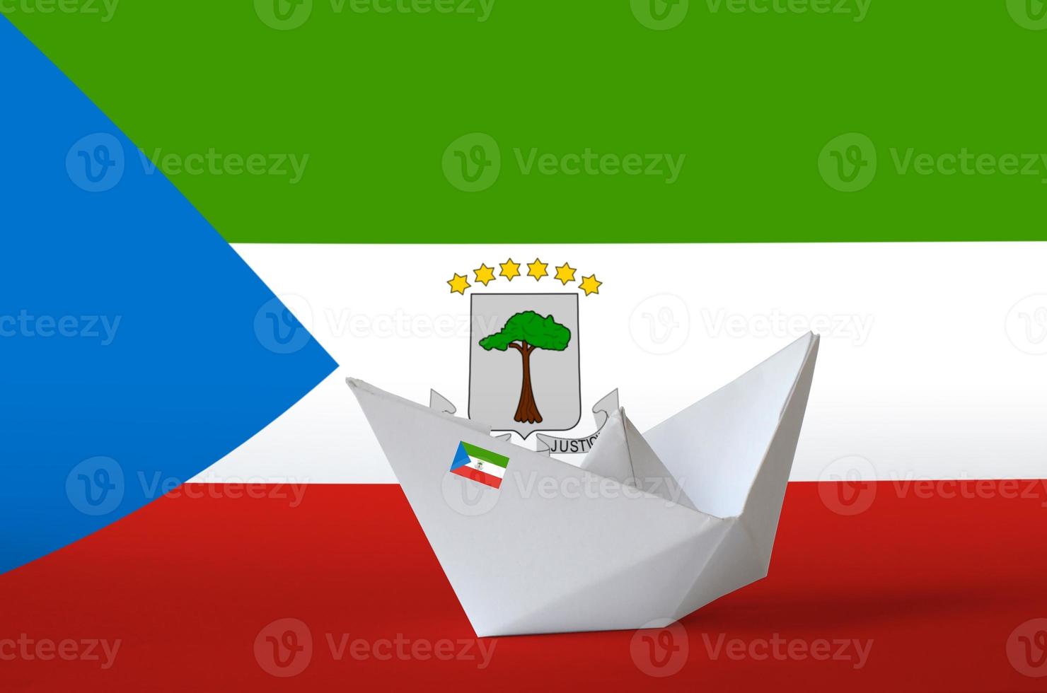 Equatorial Guinea flag depicted on paper origami ship closeup. Handmade arts concept photo