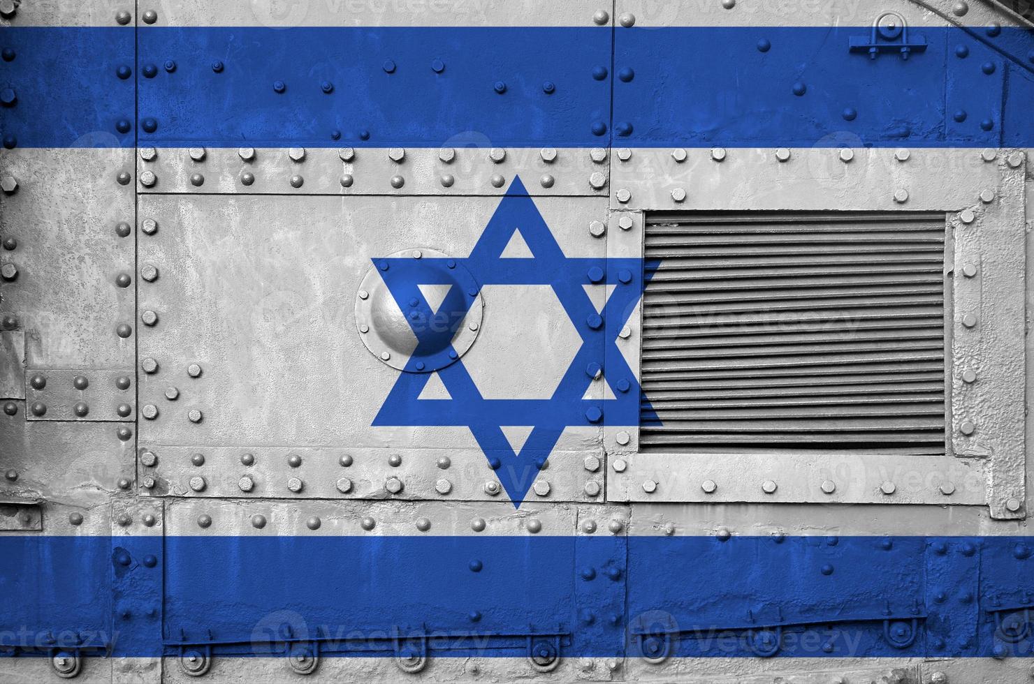 Israel flag depicted on side part of military armored tank closeup. Army forces conceptual background photo