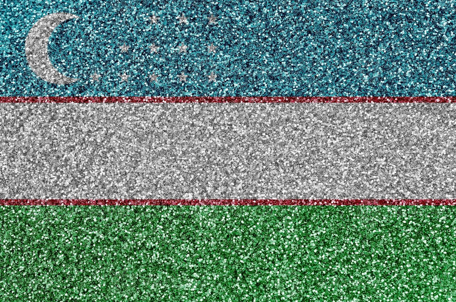 Uzbekistan flag depicted on many small shiny sequins. Colorful festival background for party photo