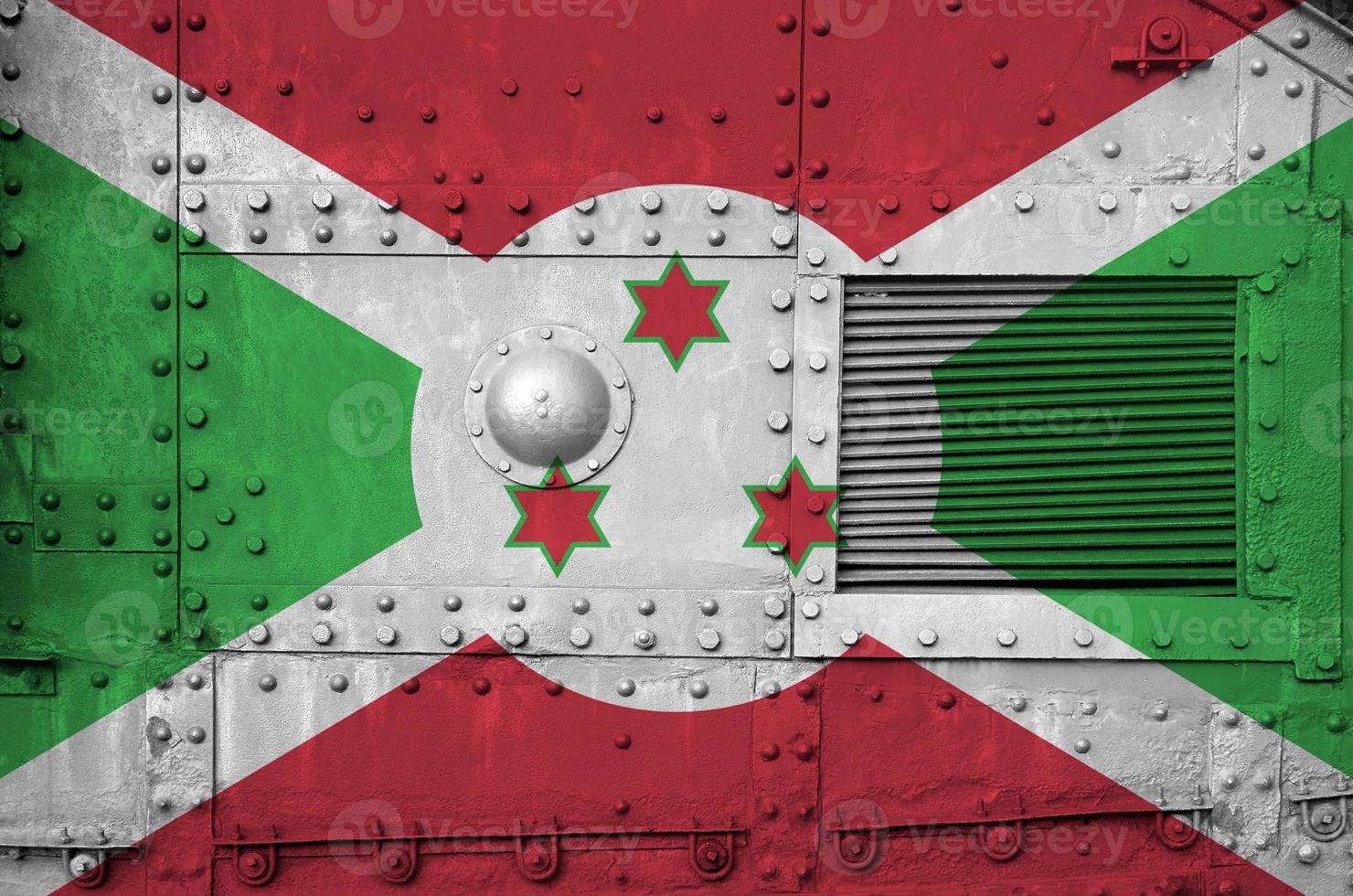 Burundi flag depicted on side part of military armored tank closeup. Army forces conceptual background photo