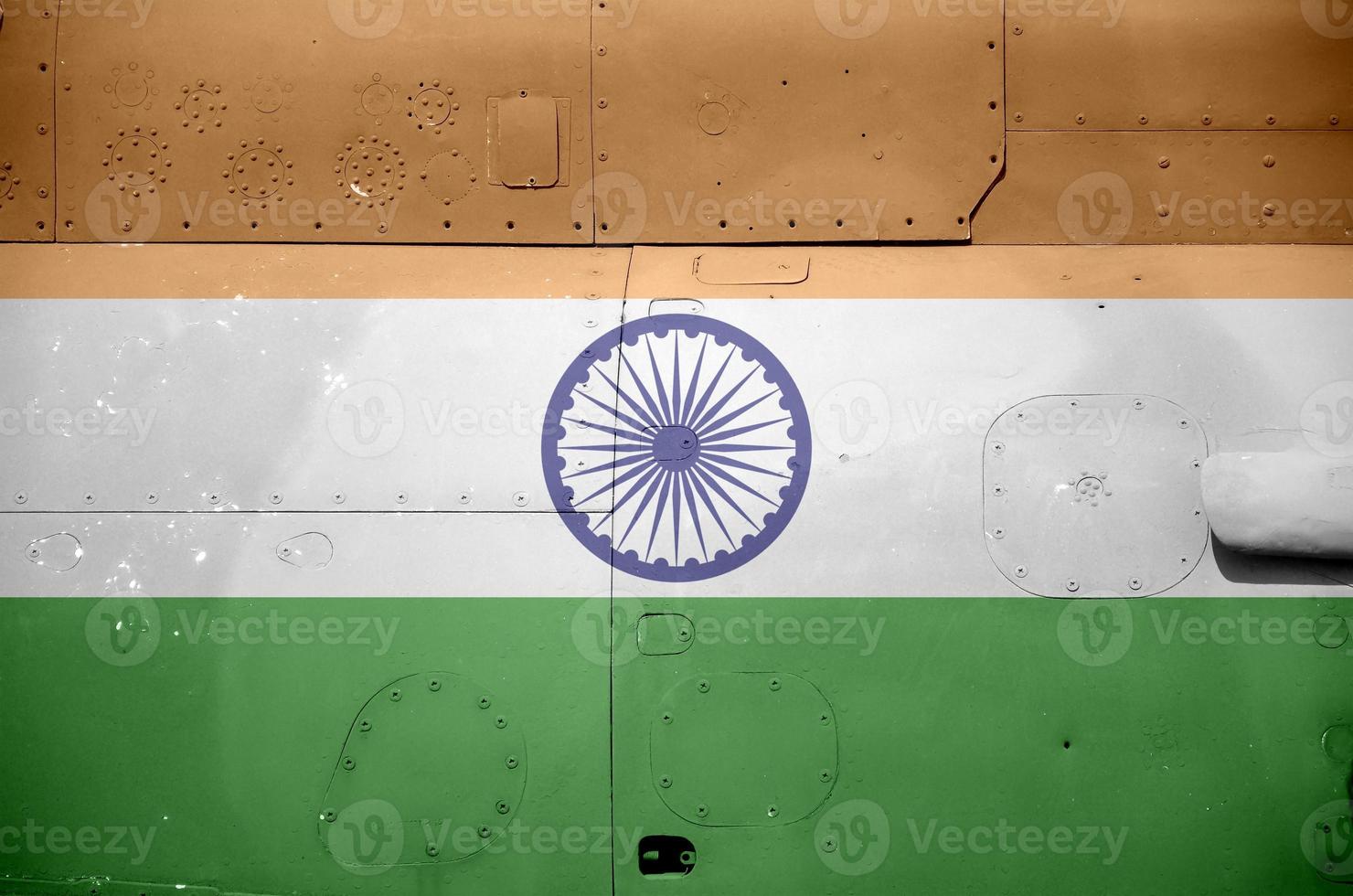 India flag depicted on side part of military armored helicopter closeup. Army forces aircraft conceptual background photo