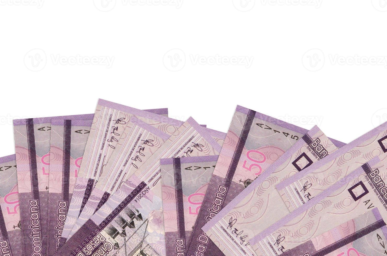 50 Dominican pesos bills lies on bottom side of screen isolated on white background with copy space. Background banner template photo