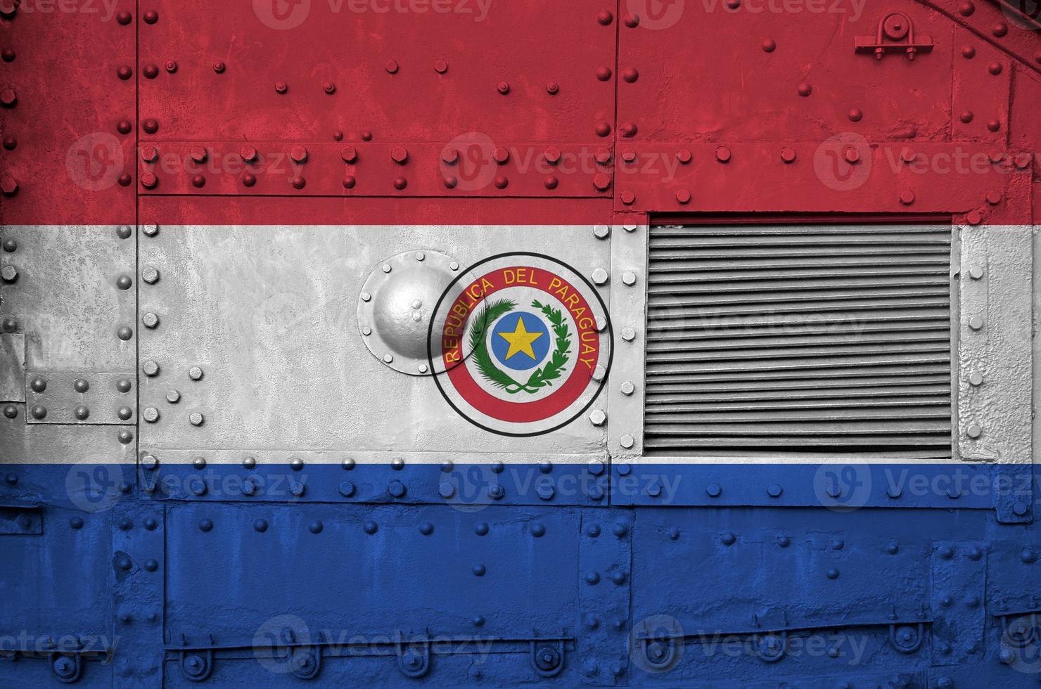 Paraguay flag depicted on side part of military armored tank closeup. Army forces conceptual background photo