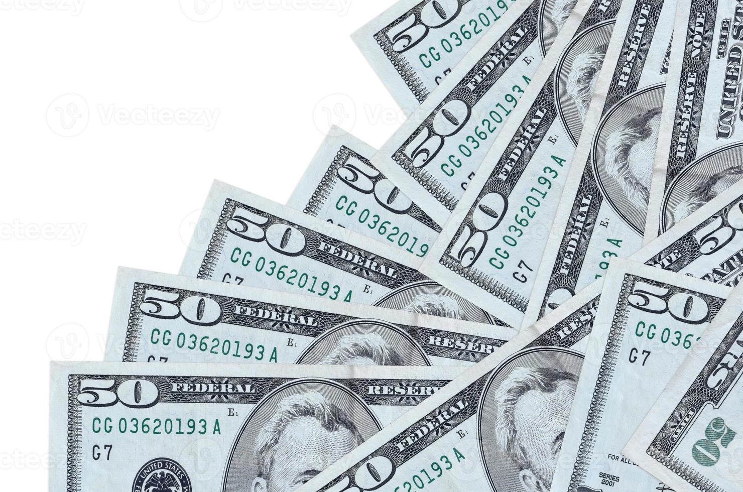 50 US dollars bills lies in different order isolated on white. Local banking or money making concept photo