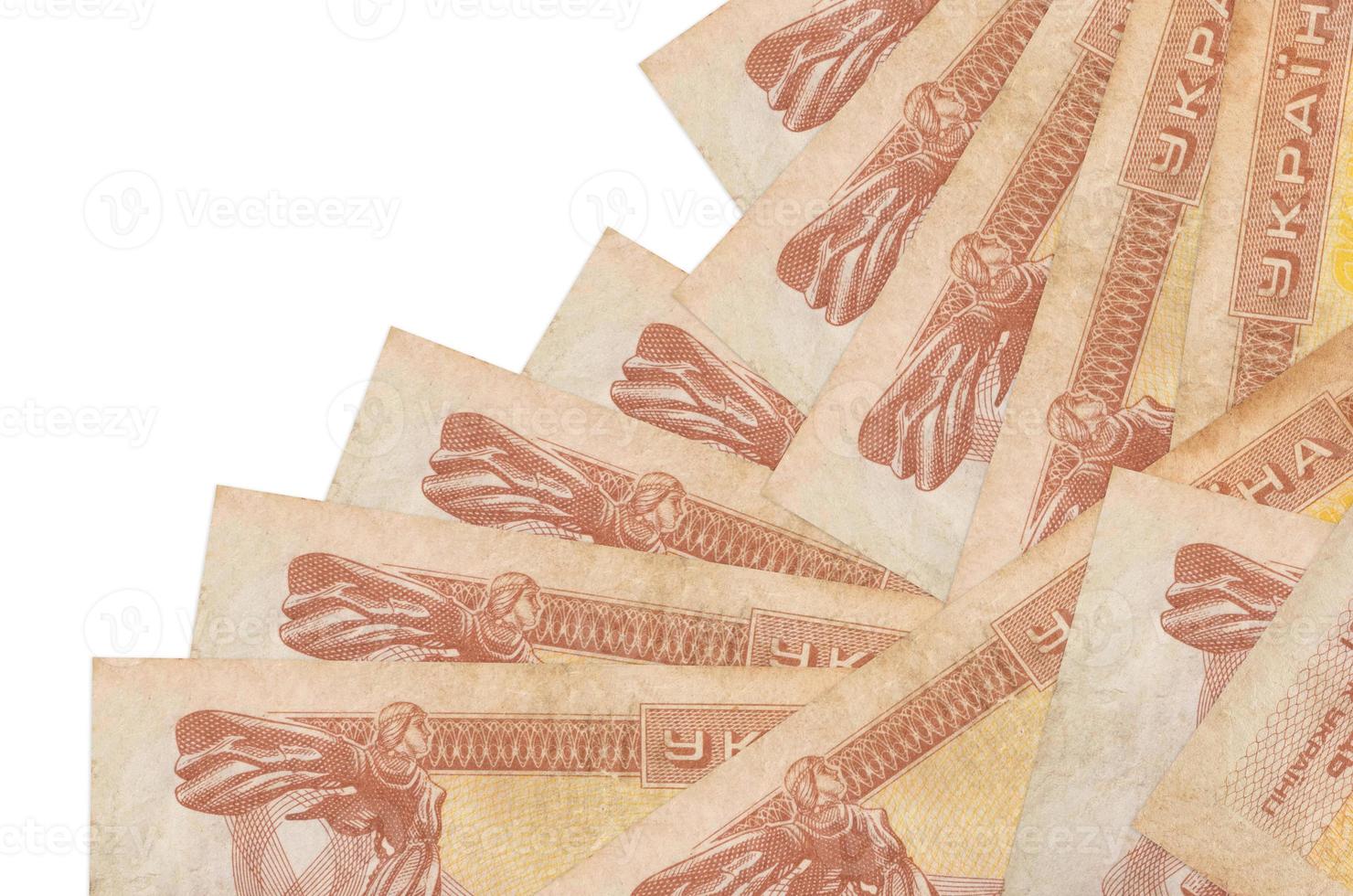 1 Ukrainian coupon bills lies in different order isolated on white. Local banking or money making concept photo