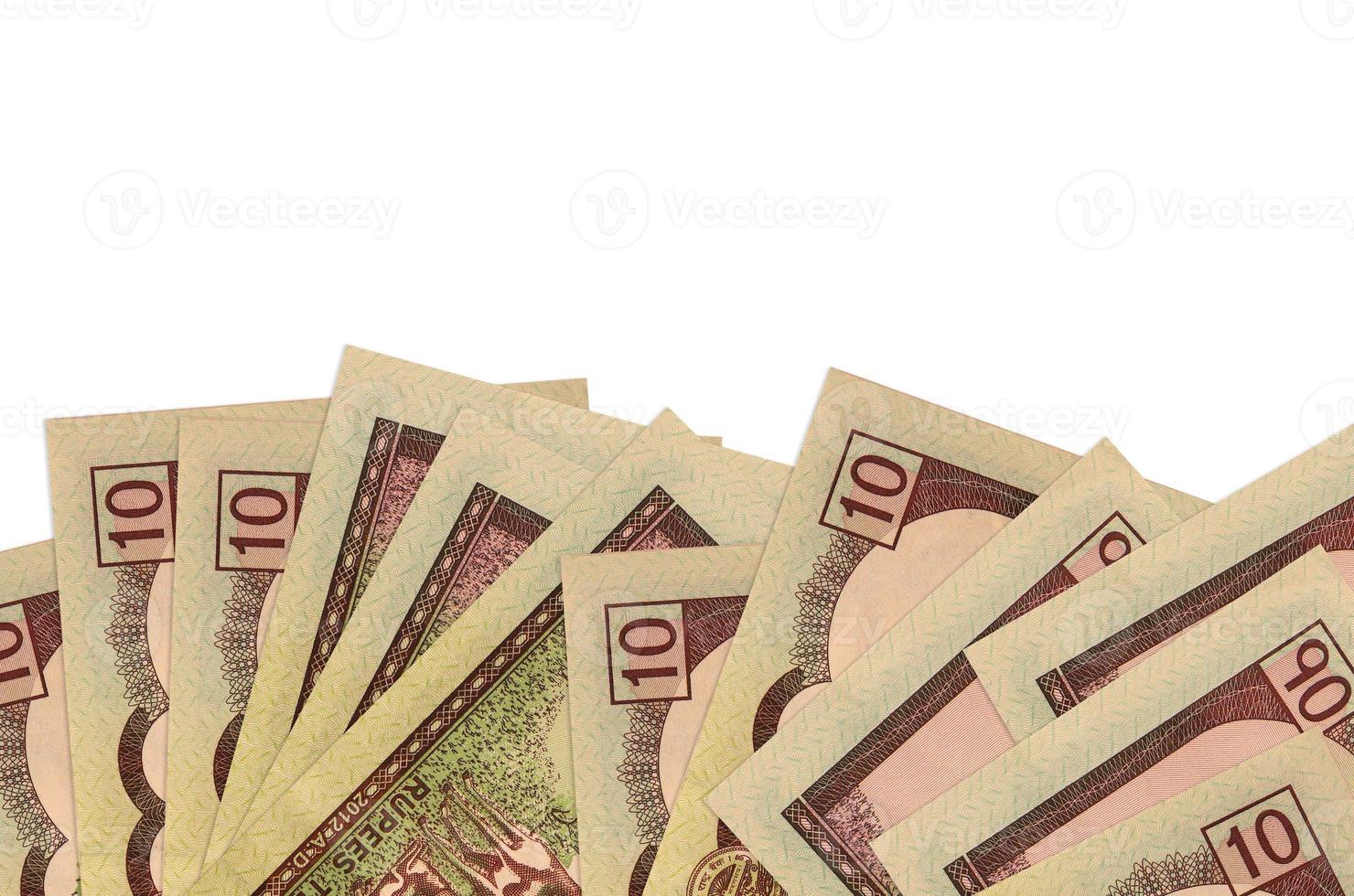 10 Nepalese rupees bills lies on bottom side of screen isolated on white background with copy space. Background banner template photo