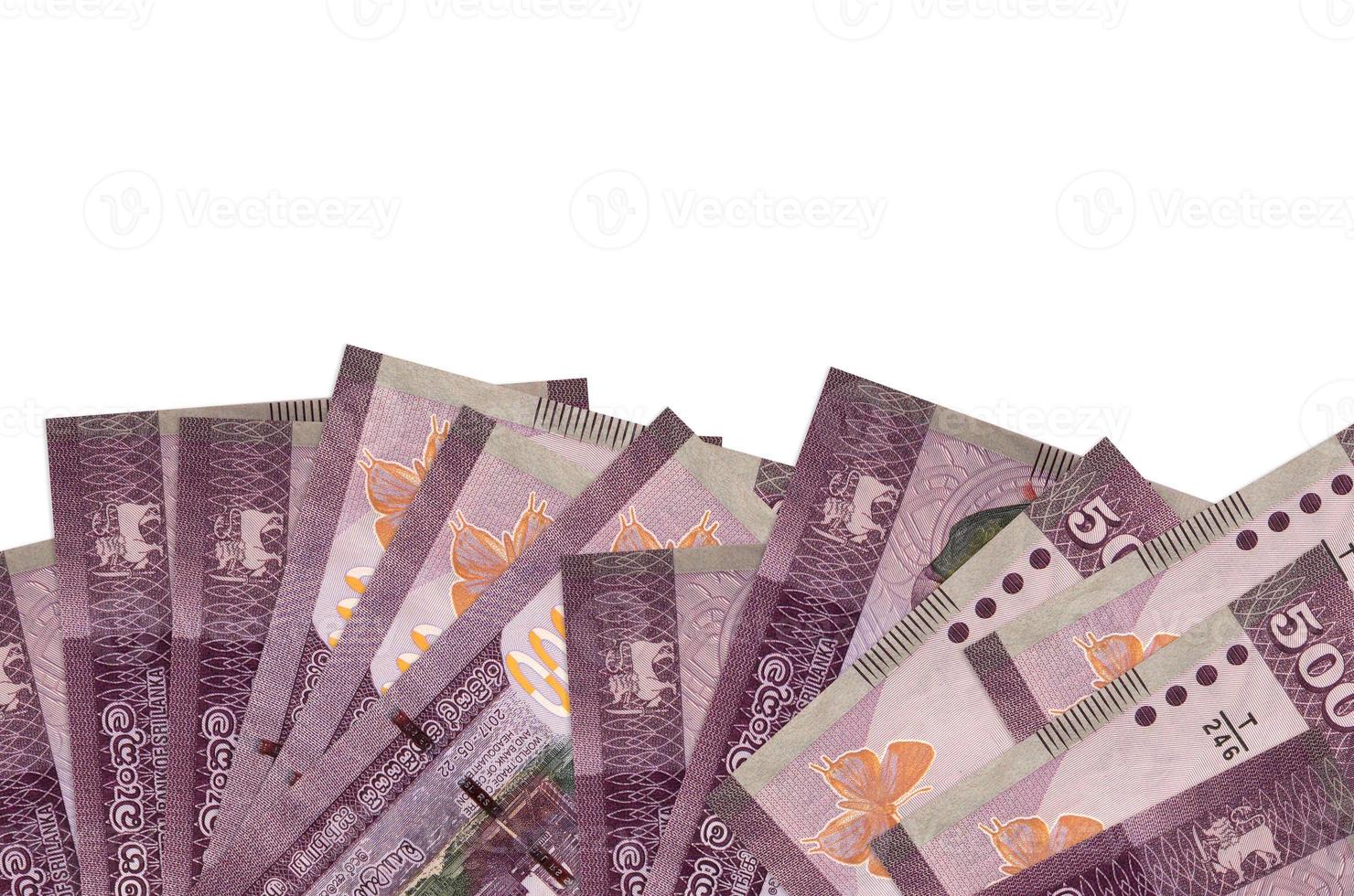 500 Sri Lankan rupees bills lies on bottom side of screen isolated on white background with copy space. Background banner template photo