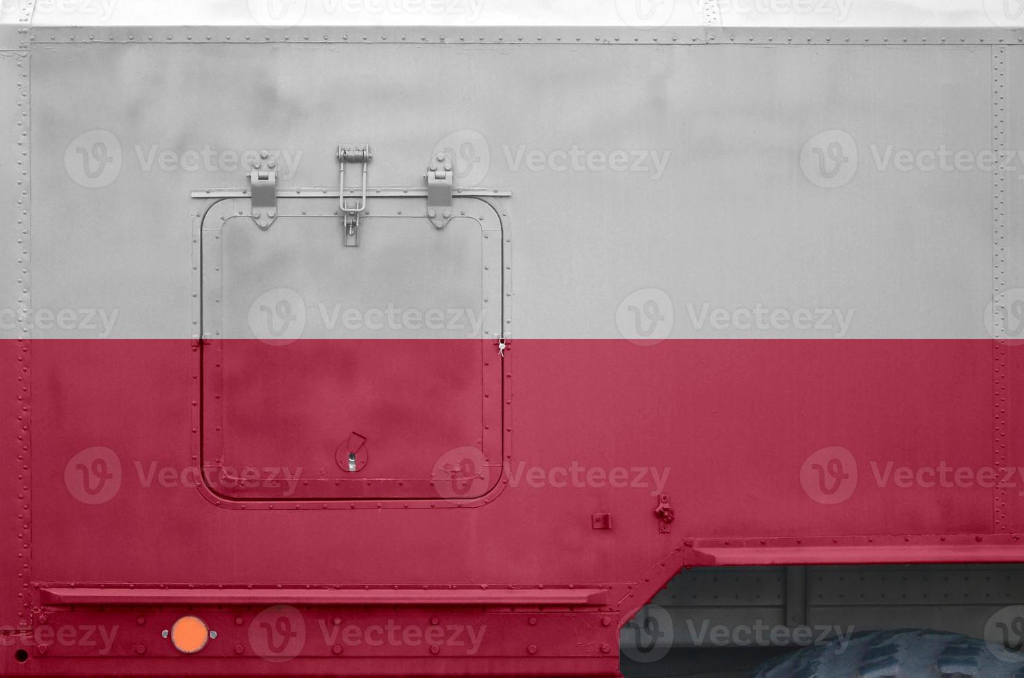 Poland flag depicted on side part of military armored truck closeup. Army forces conceptual background photo