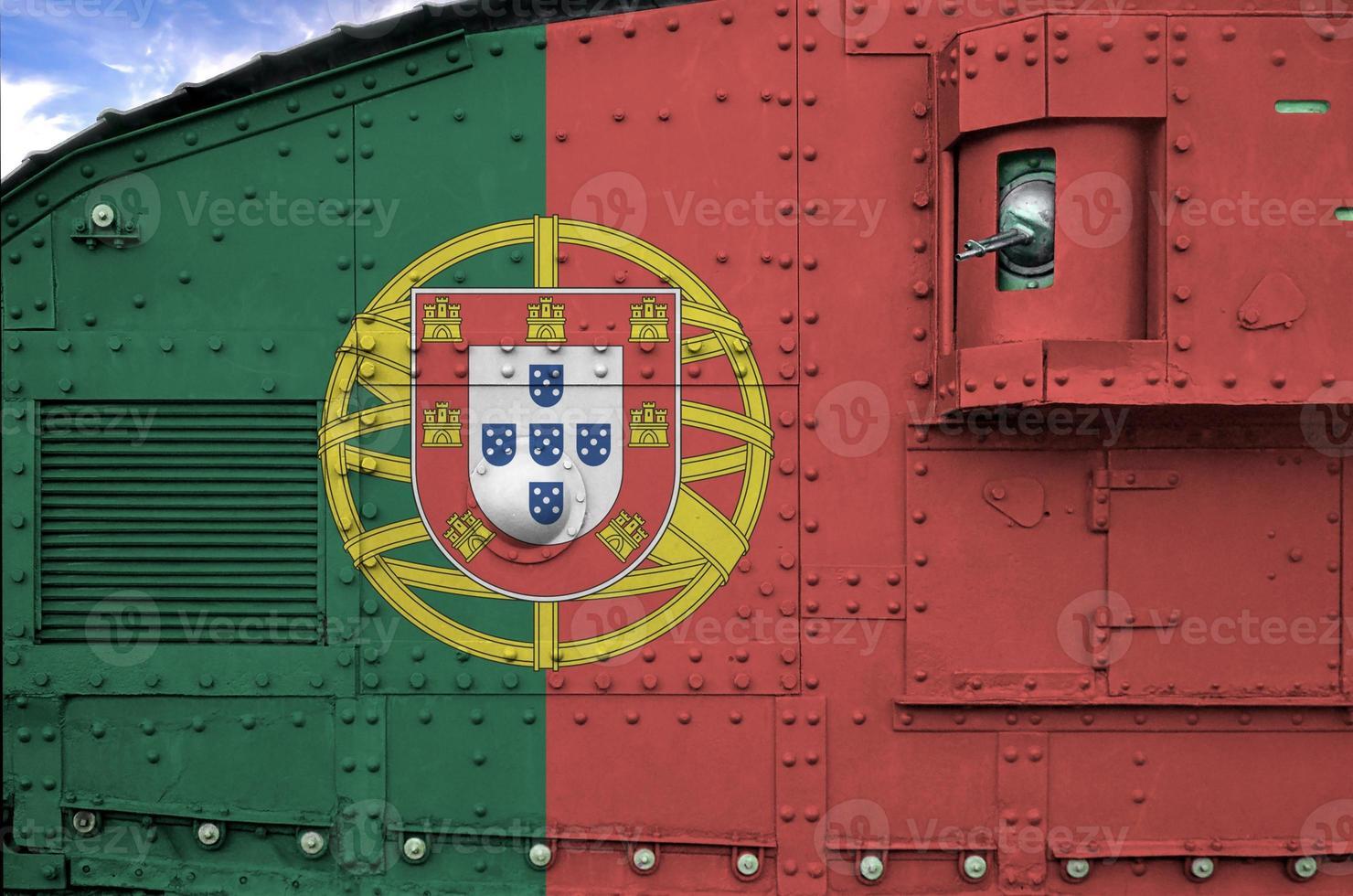 Portugal flag depicted on side part of military armored tank closeup. Army forces conceptual background photo