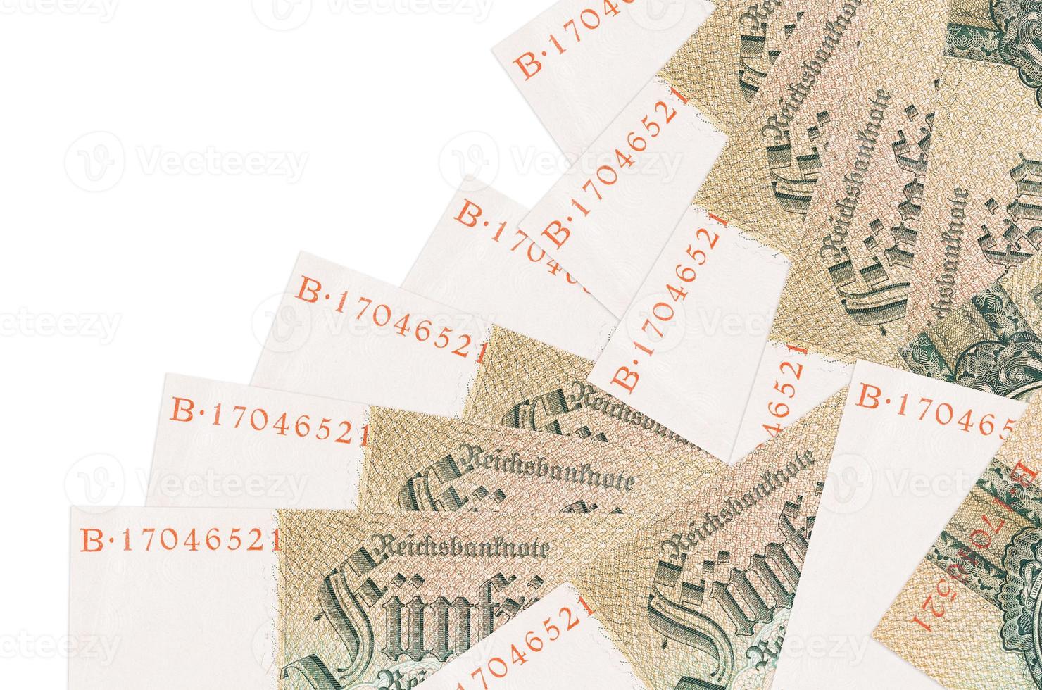 50 Reich marks bills lies in different order isolated on white. Local banking or money making concept photo