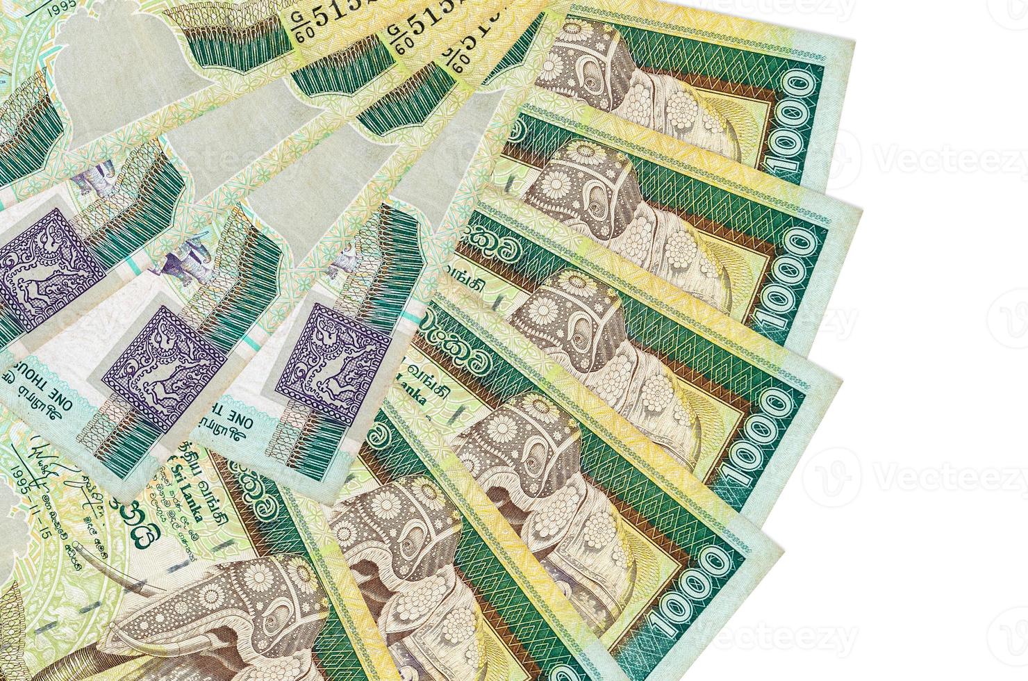 1000 Sri Lankan rupees bills lies isolated on white background with copy space stacked in fan shape close up photo