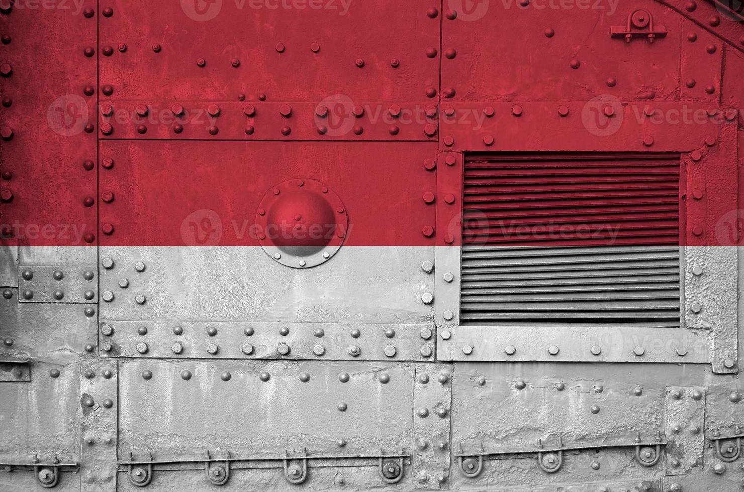 Monaco flag depicted on side part of military armored tank closeup. Army forces conceptual background photo