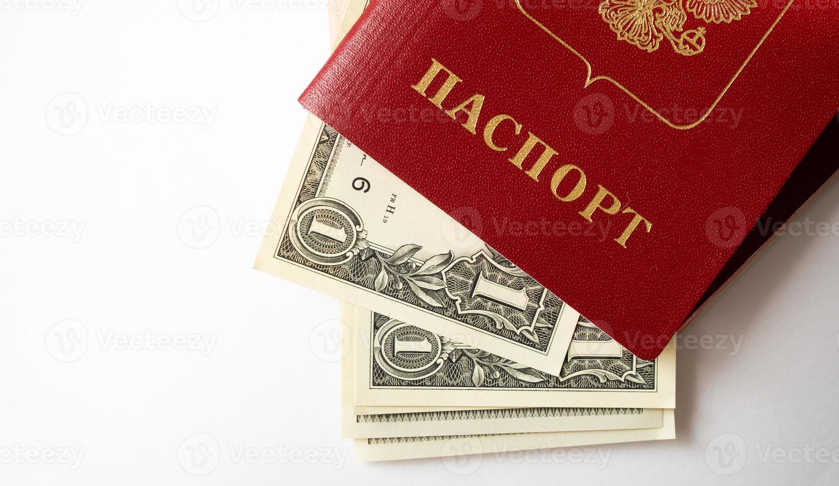 A foreign passport and dollars on a white isolated background. photo