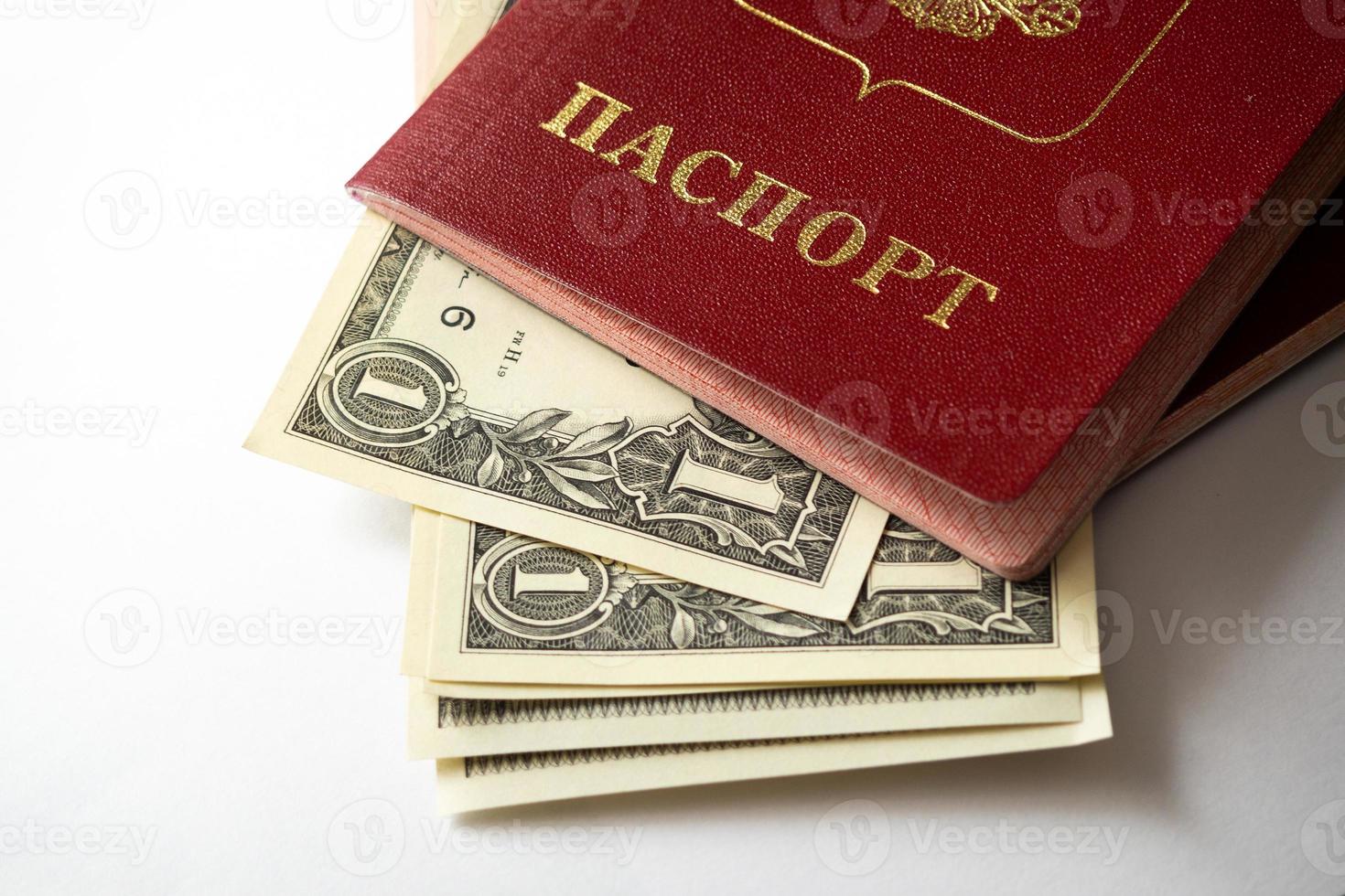 A foreign passport and dollars on a white isolated background. photo