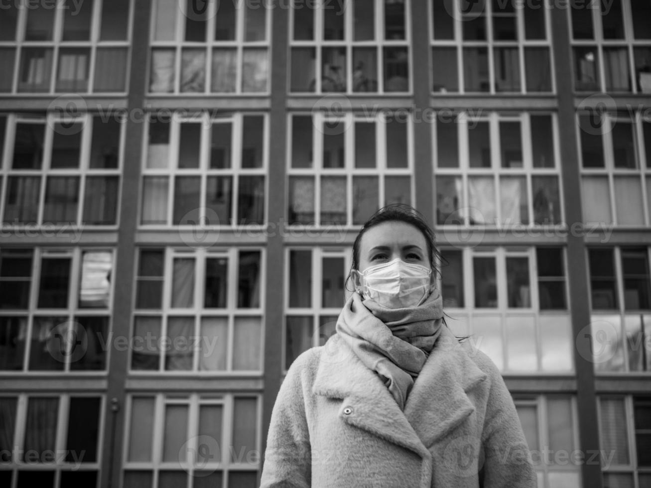 Shot of a girl in a mask, on the street. lockdown Covid-19 pandemic. photo