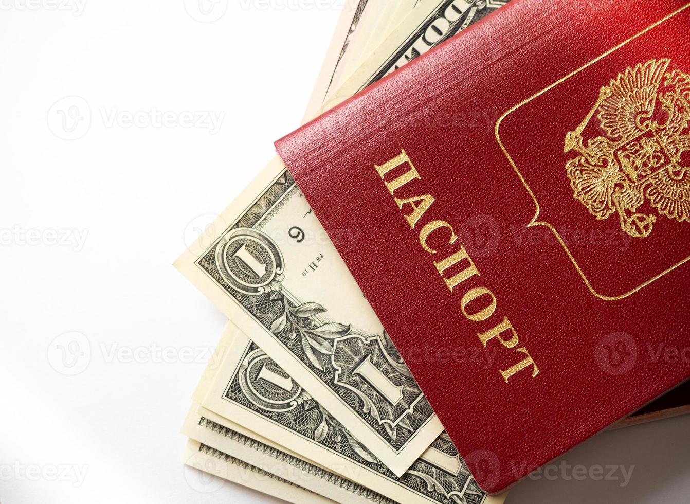 A foreign passport and dollars on a white isolated background. photo