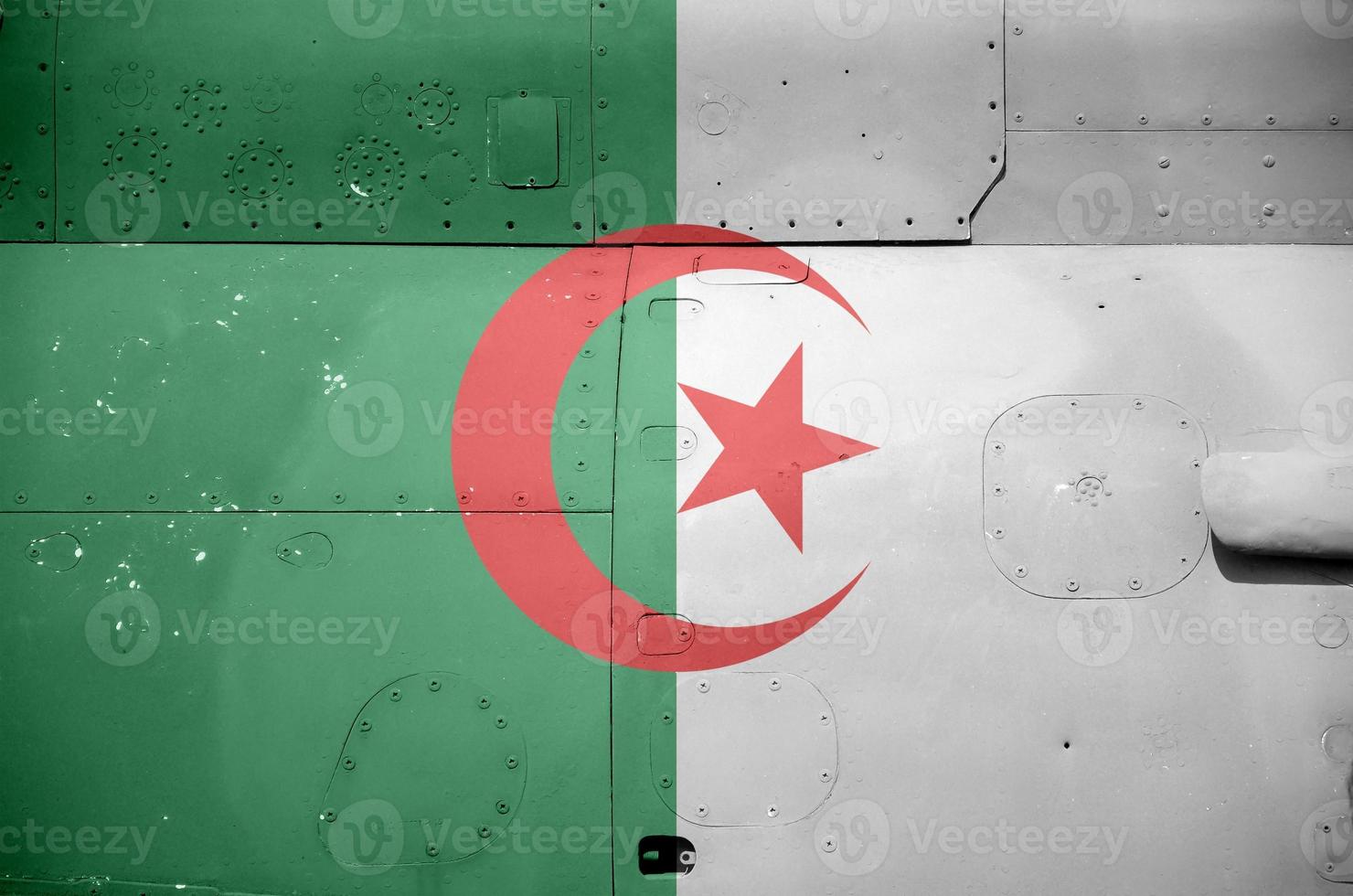 Algeria flag depicted on side part of military armored helicopter closeup. Army forces aircraft conceptual background photo