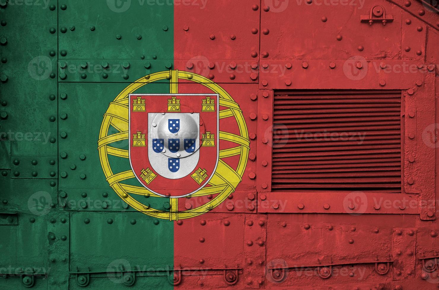 Portugal flag depicted on side part of military armored tank closeup. Army forces conceptual background photo