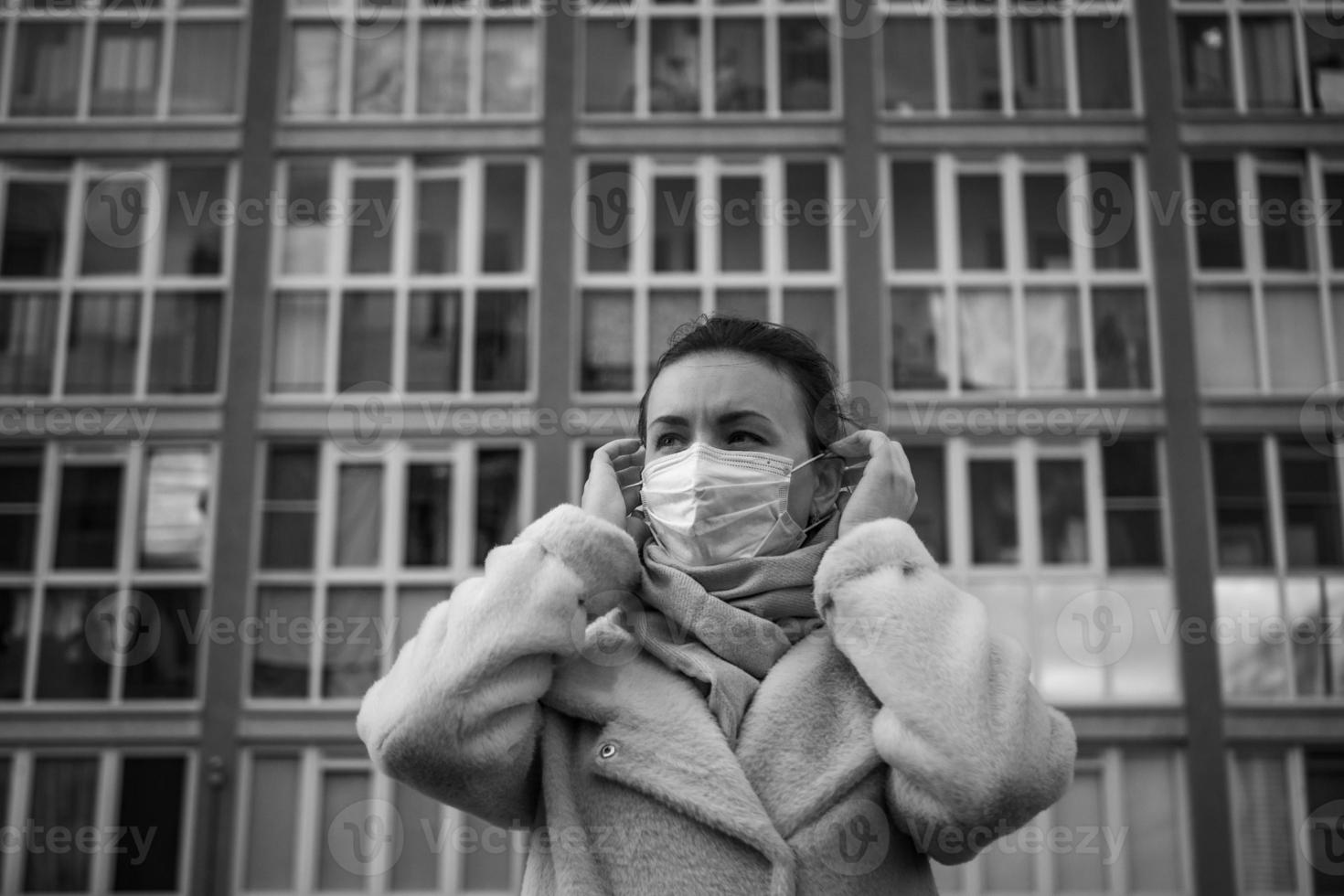 Shot of a girl in a mask, on the street. lockdown Covid-19 pandemic. photo