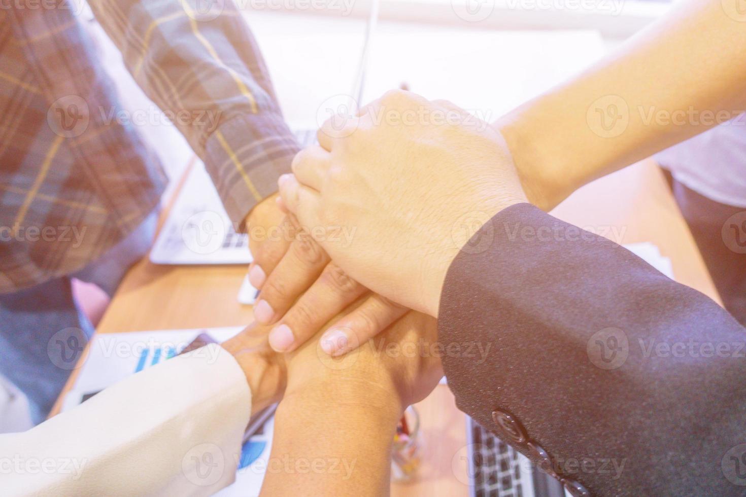 Business people stacking hands. photo