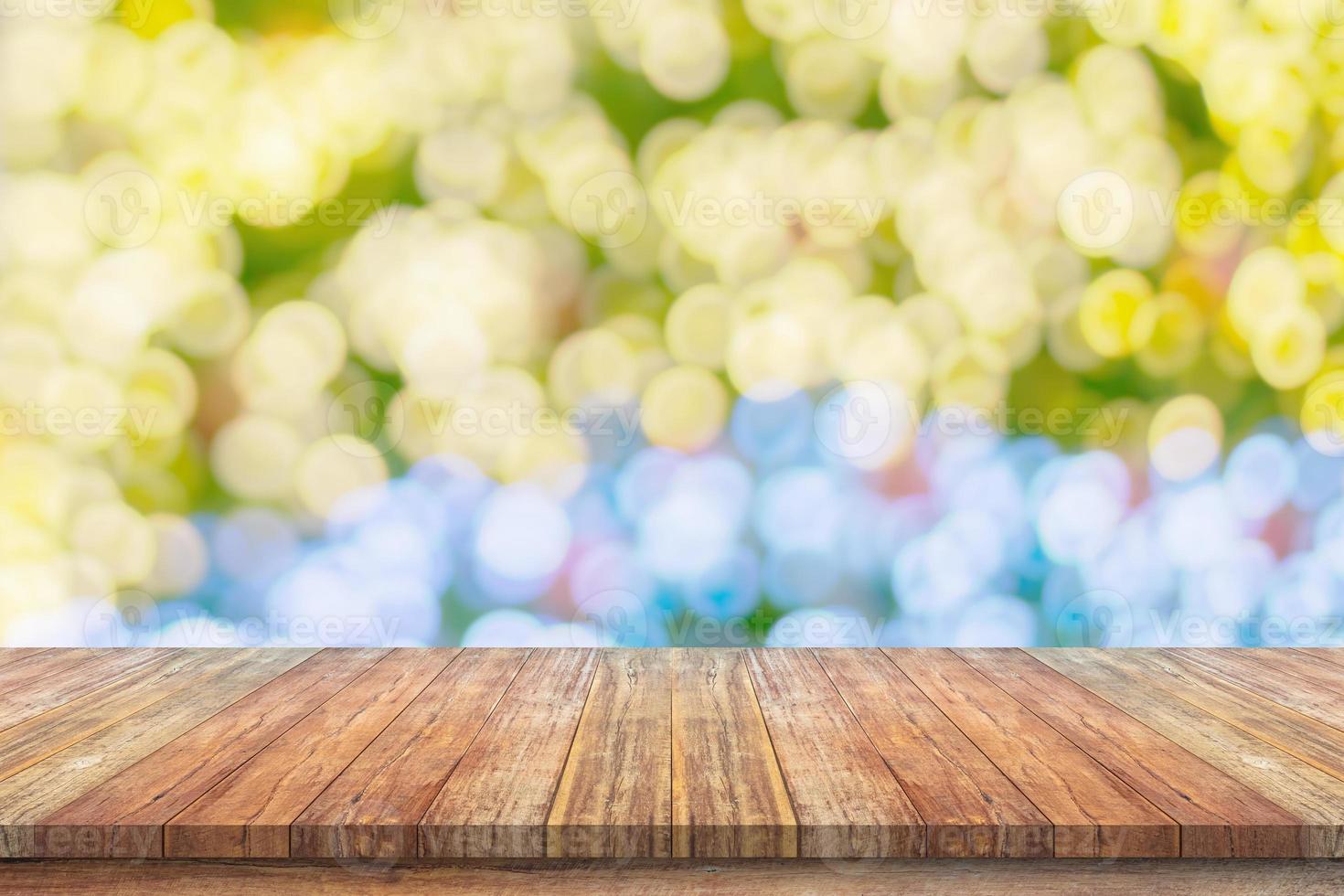 Empty wood table top with blur Christmas tree with bokeh light background photo