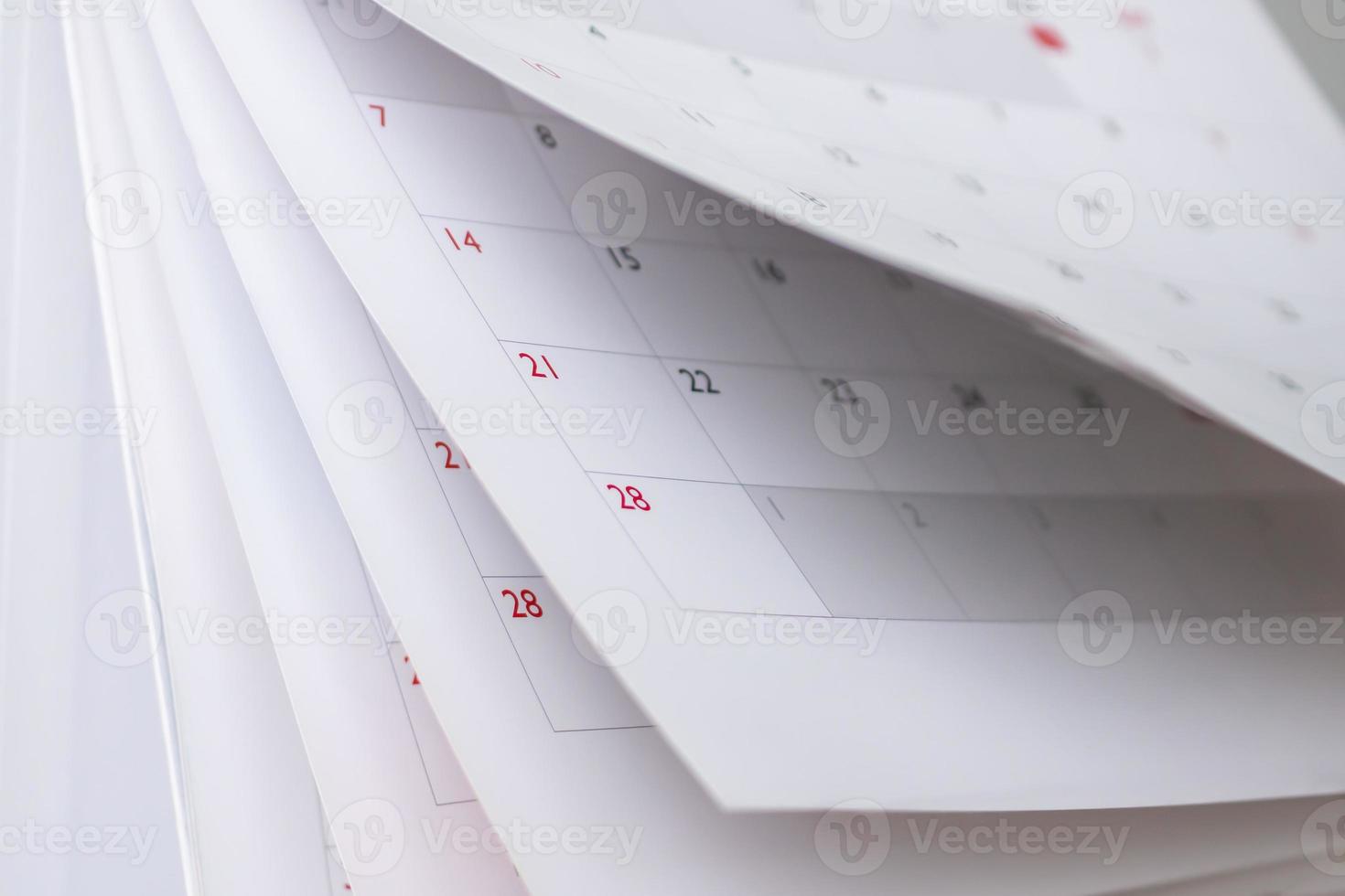 página del calendario hoja de volteo primer plano fondo borroso horario de negocios planificación cita reunión concepto foto