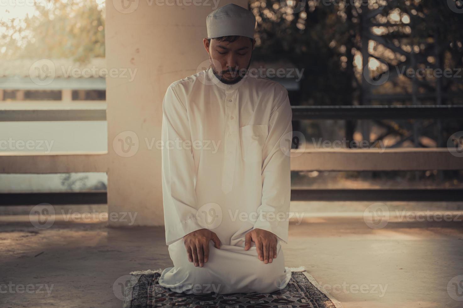 Asian islam man prayer,Young Muslim praying,Ramadan festival concept photo