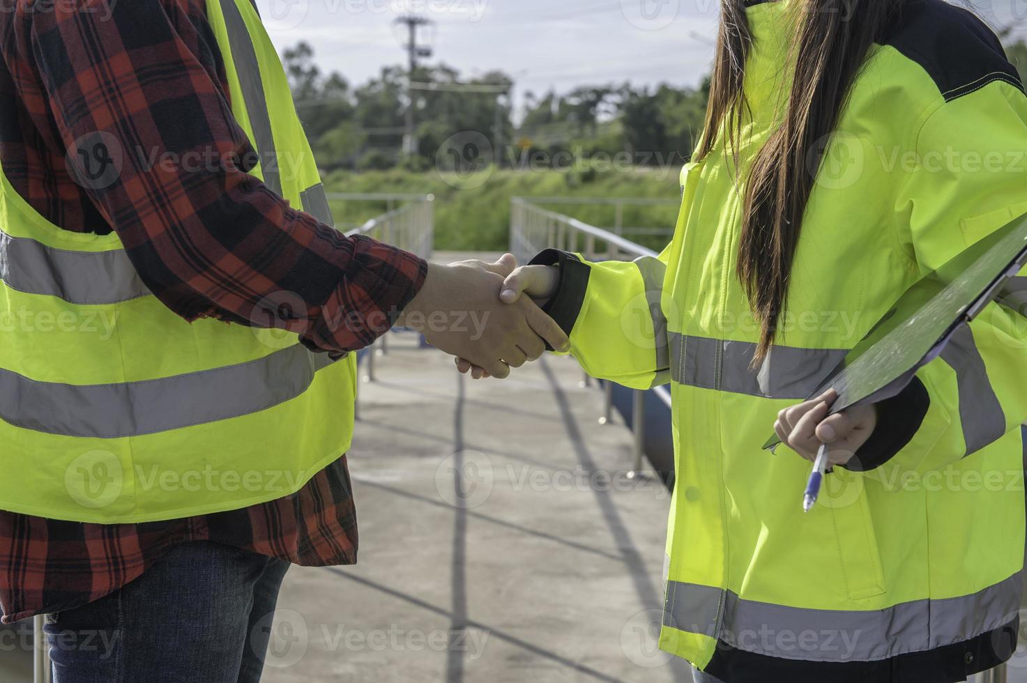 Environmental engineers work at wastewater treatment plants,Water supply engineering working at Water recycling plant for reuse,Technicians and engineers discuss work together. photo