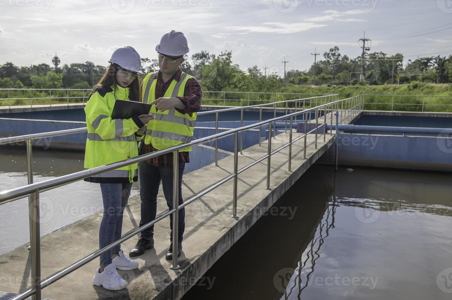 Environmental engineers work at wastewater treatment plants,Water