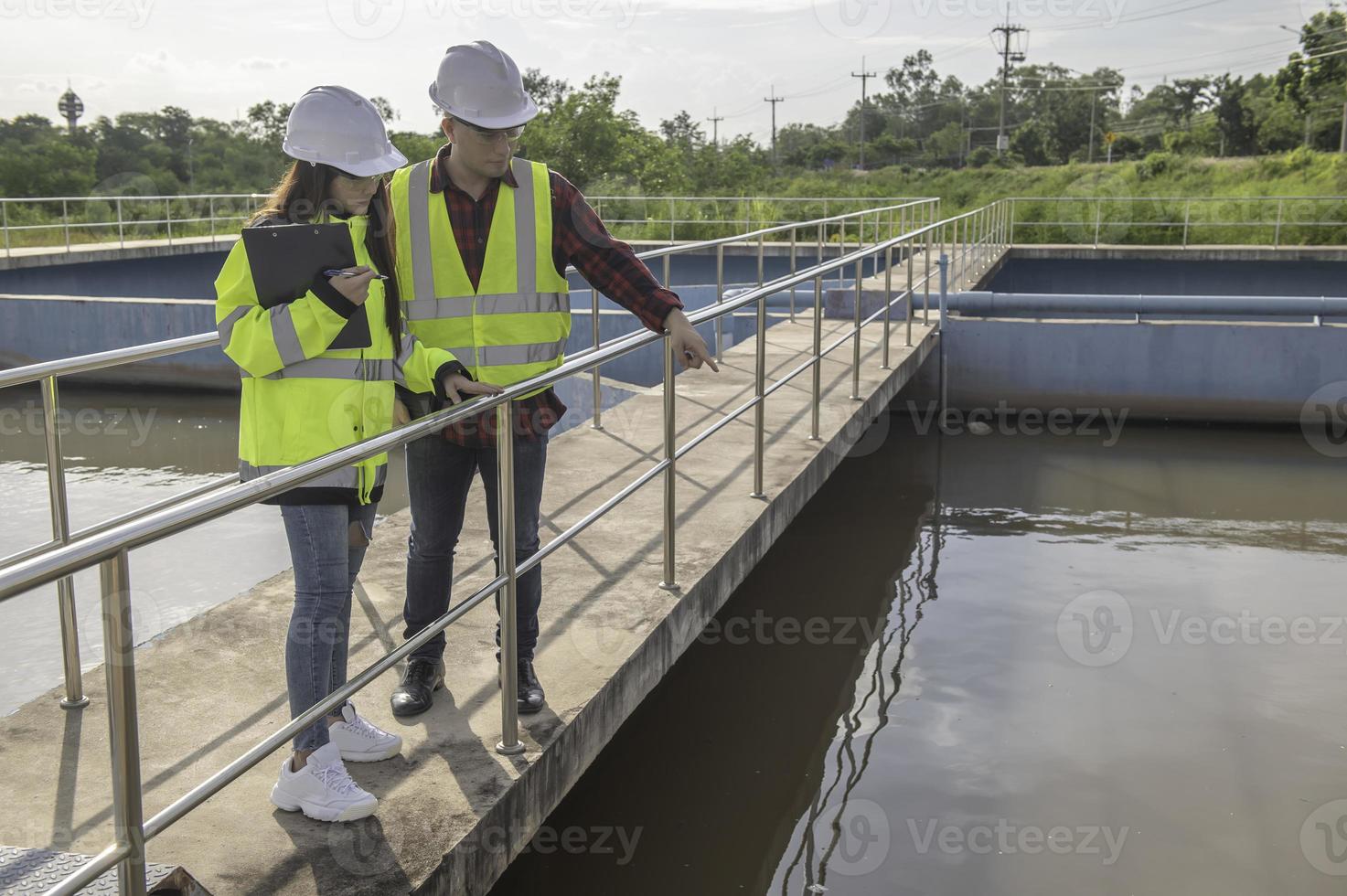 Environmental engineers work at wastewater treatment plants,Water
