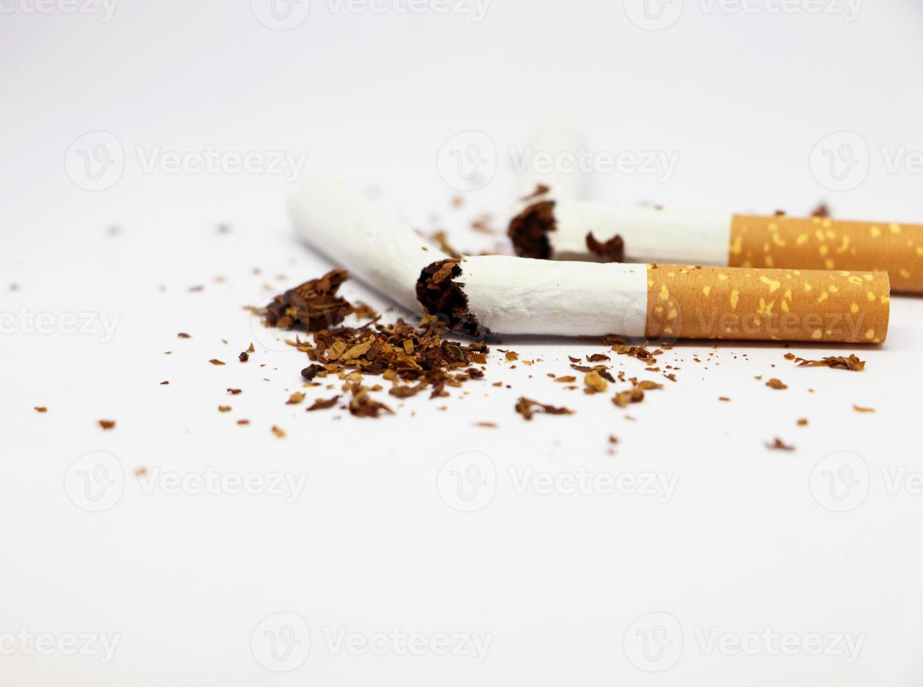 Stop smoking concept Half and Half broken cigarette isolated on white background photo