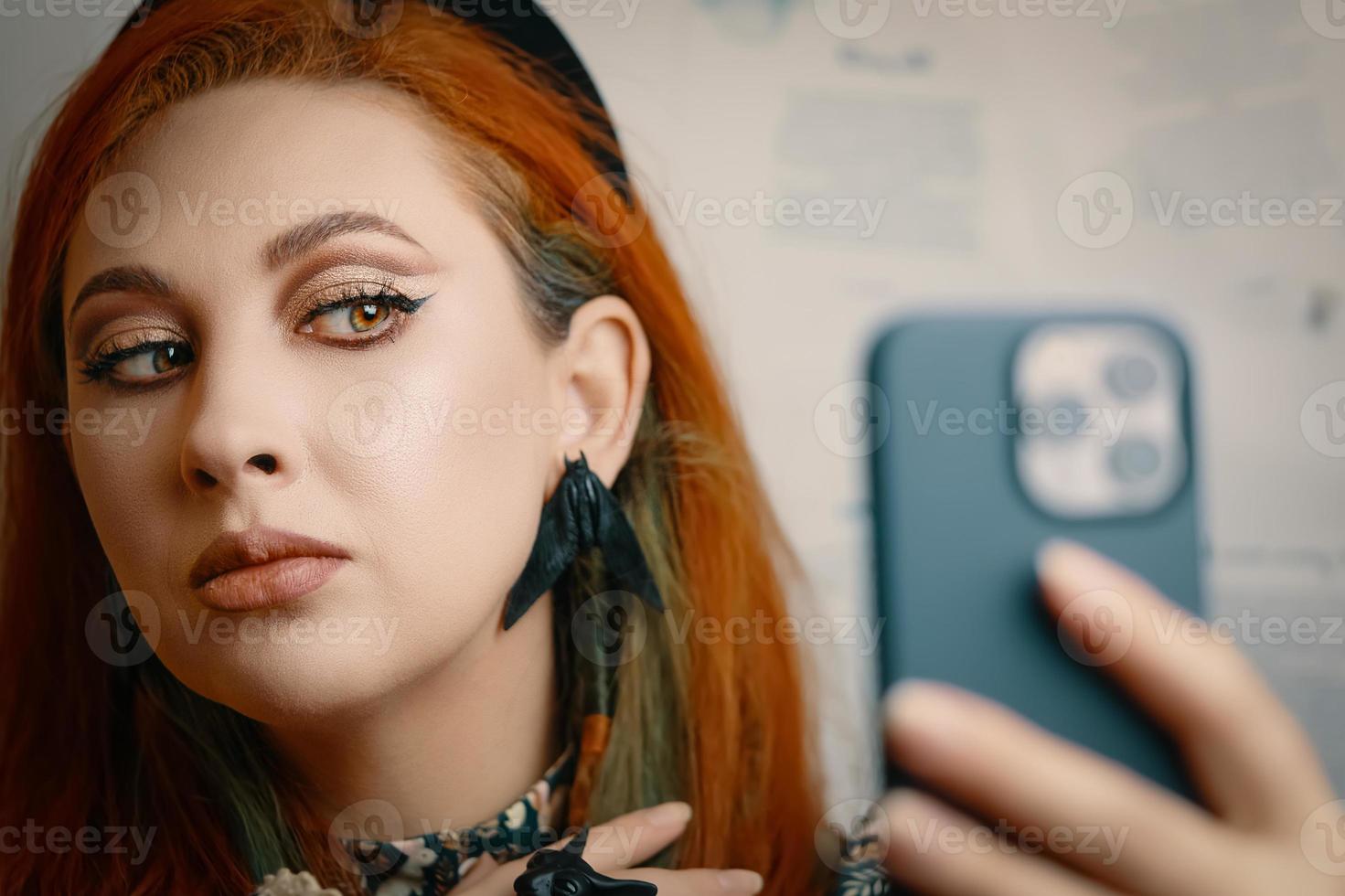 Female blogger runs a blog about fashion and makeup. photo