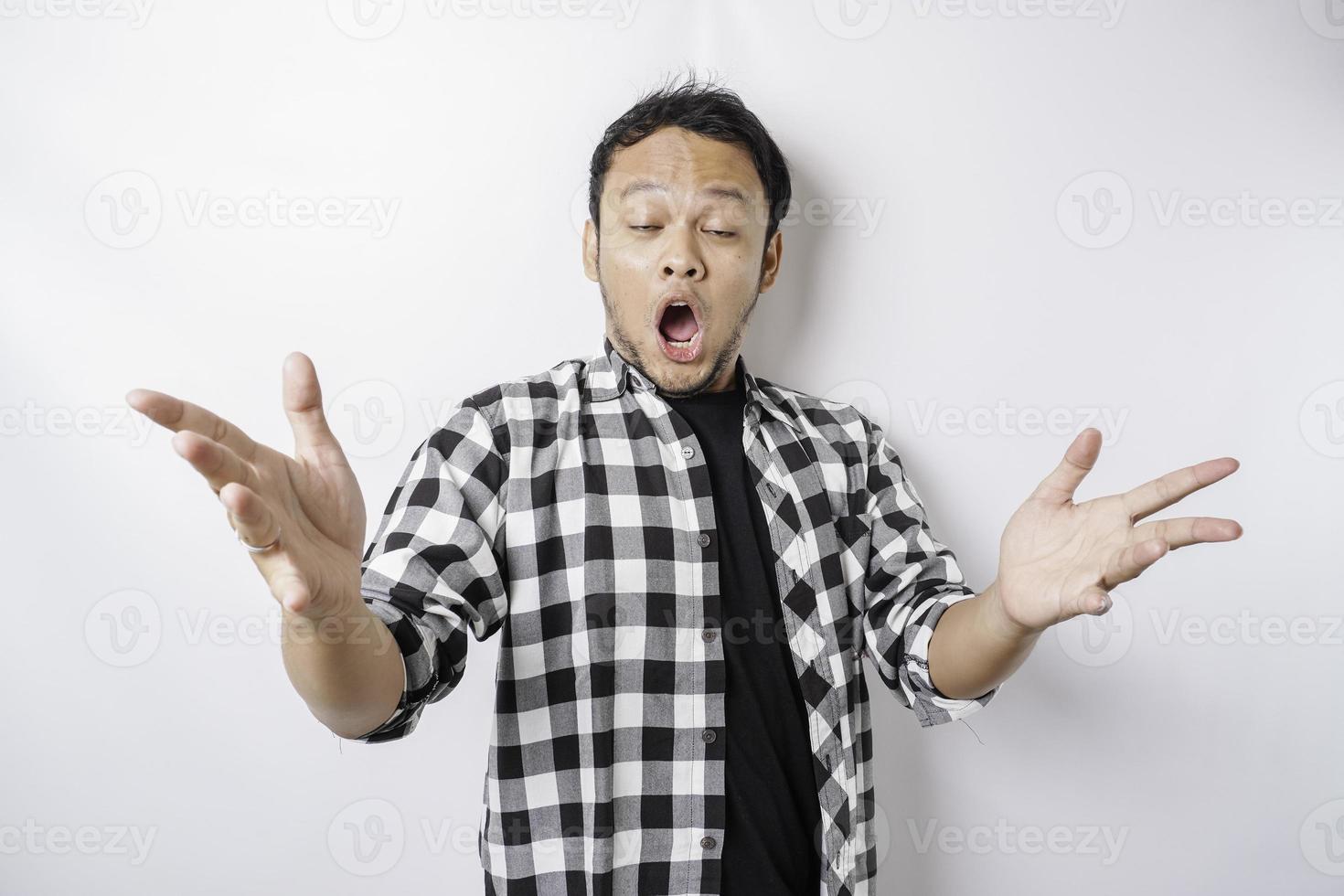 A portrait of a shocked Asian isolated by a white background photo