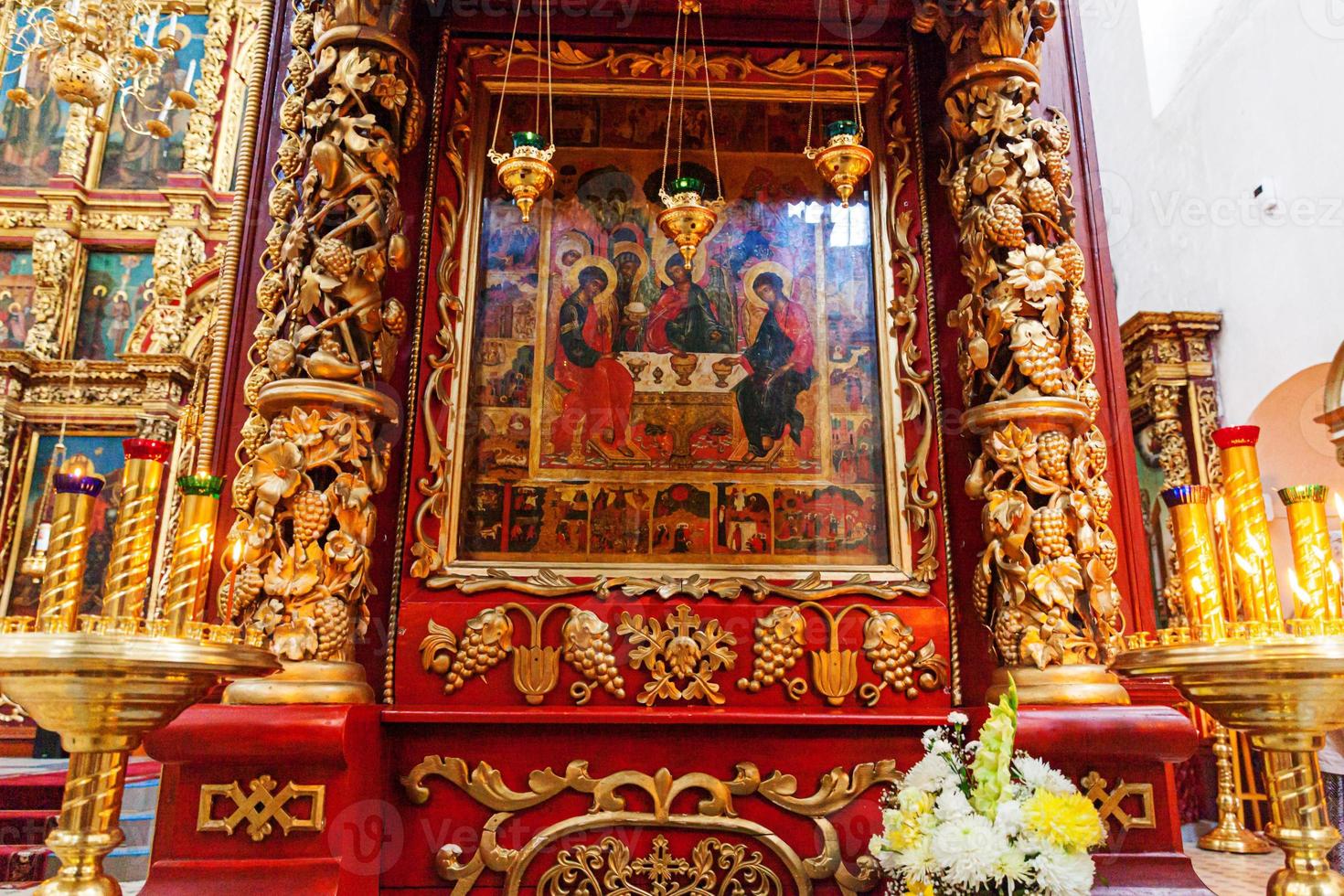 Orthodox Church. Christianity. Festive interior decoration with burning candles and icon in traditional Orthodox Church on Easter Eve or Christmas. Religion faith pray symbol. photo