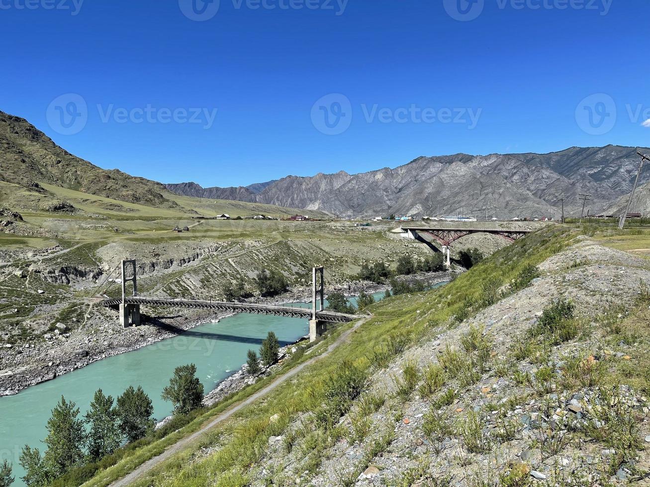 Old bridge across the Katun river in the Inya village, Altai, Russia photo