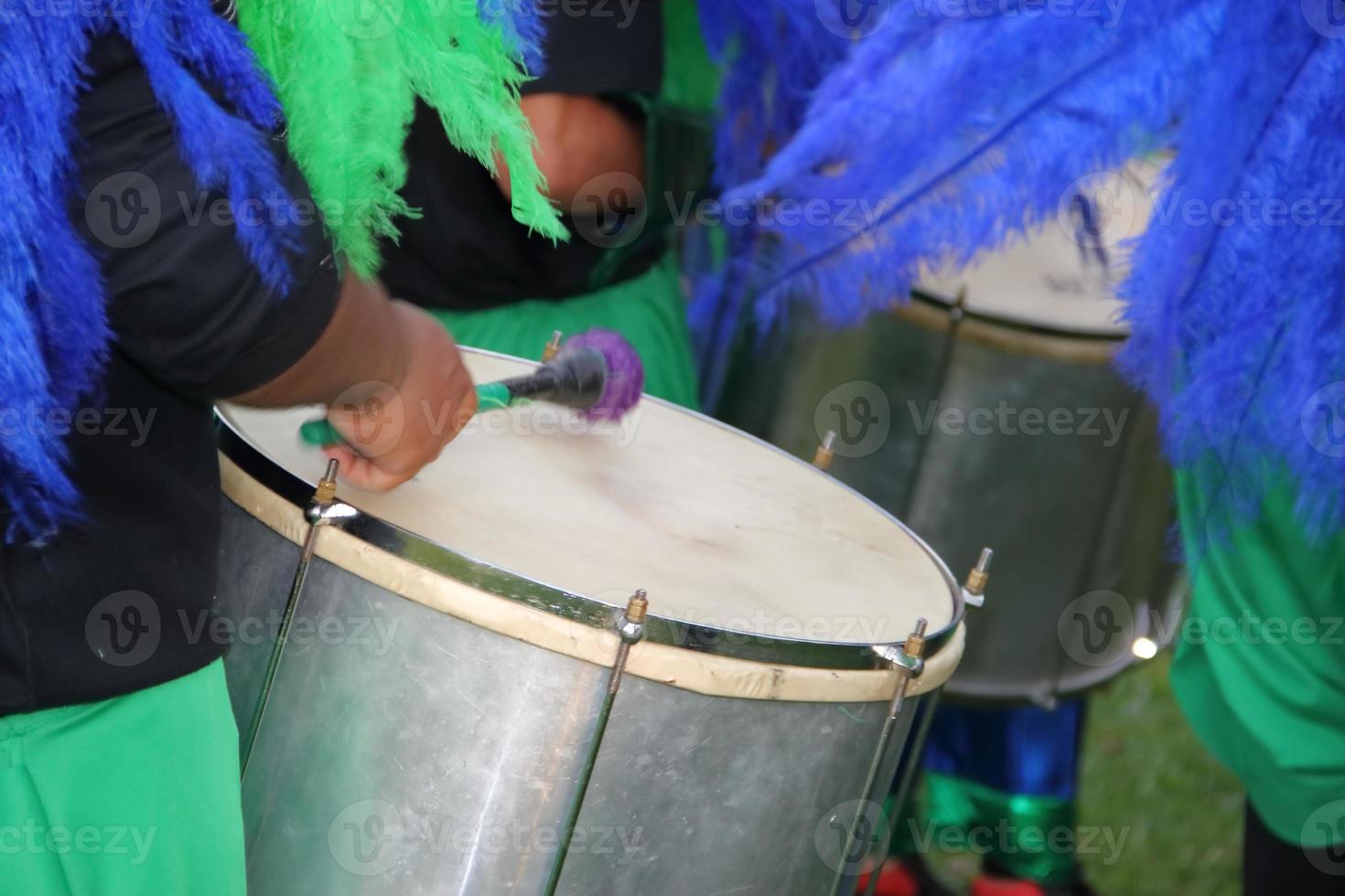 percussion instruments feathers and carnival embroidery photo