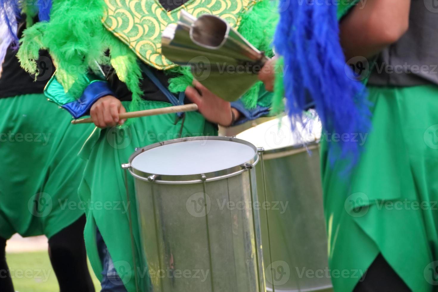 percussion instruments feathers and carnival embroidery photo