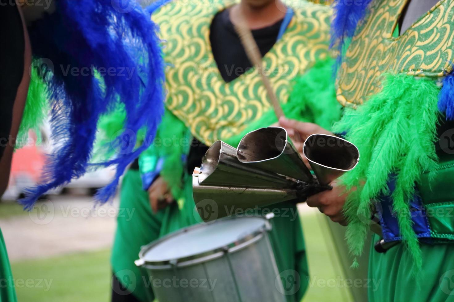 percussion instruments feathers and carnival embroidery photo