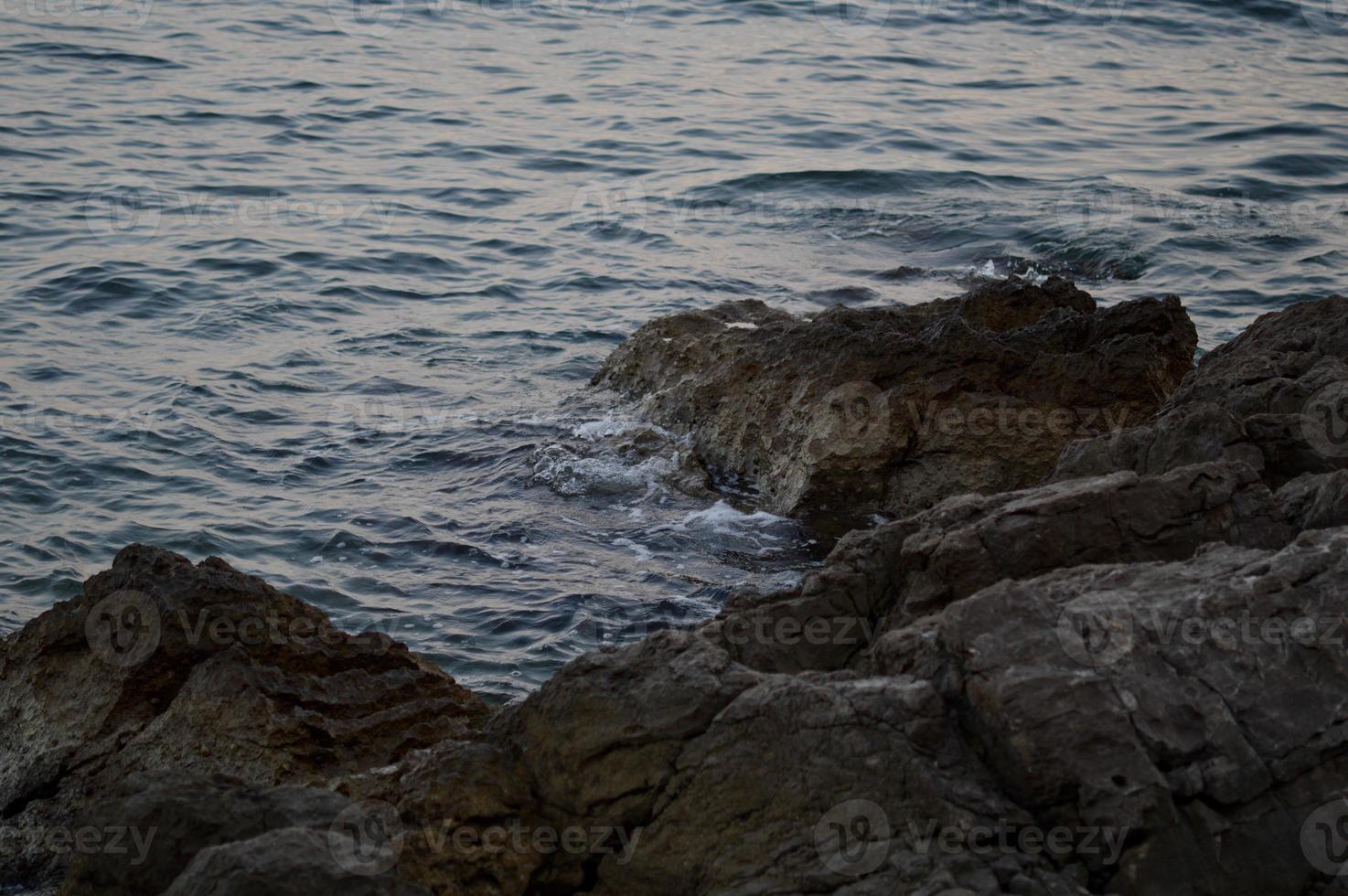 Croatia beach, rocks at the beach, sea water, waves photo