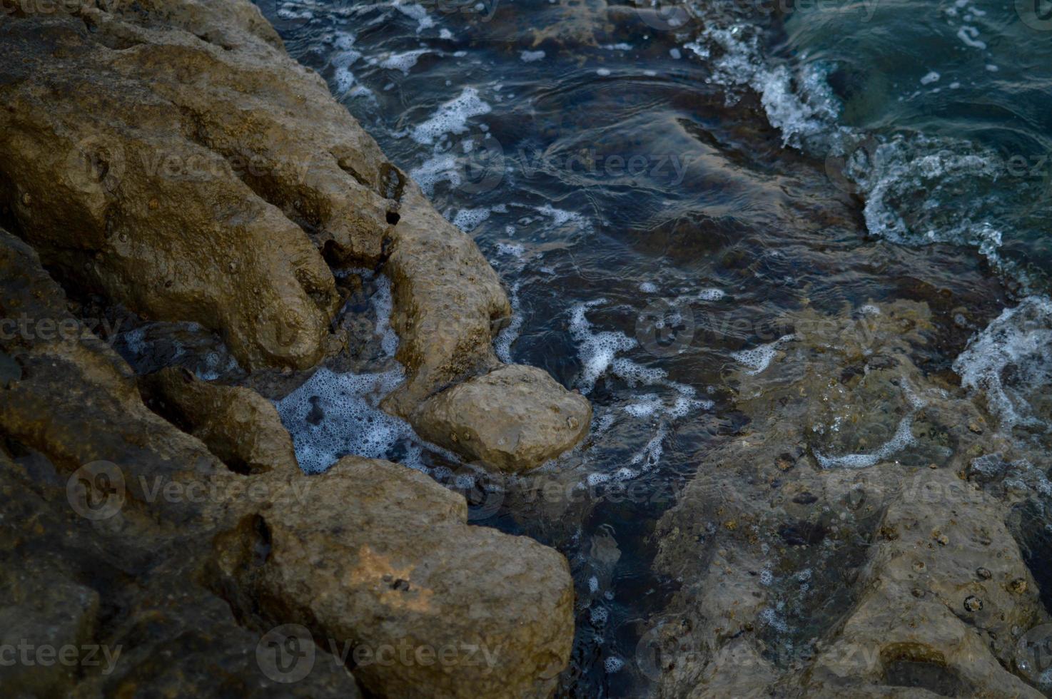 Rocks at the sea, sea waves crashing photo