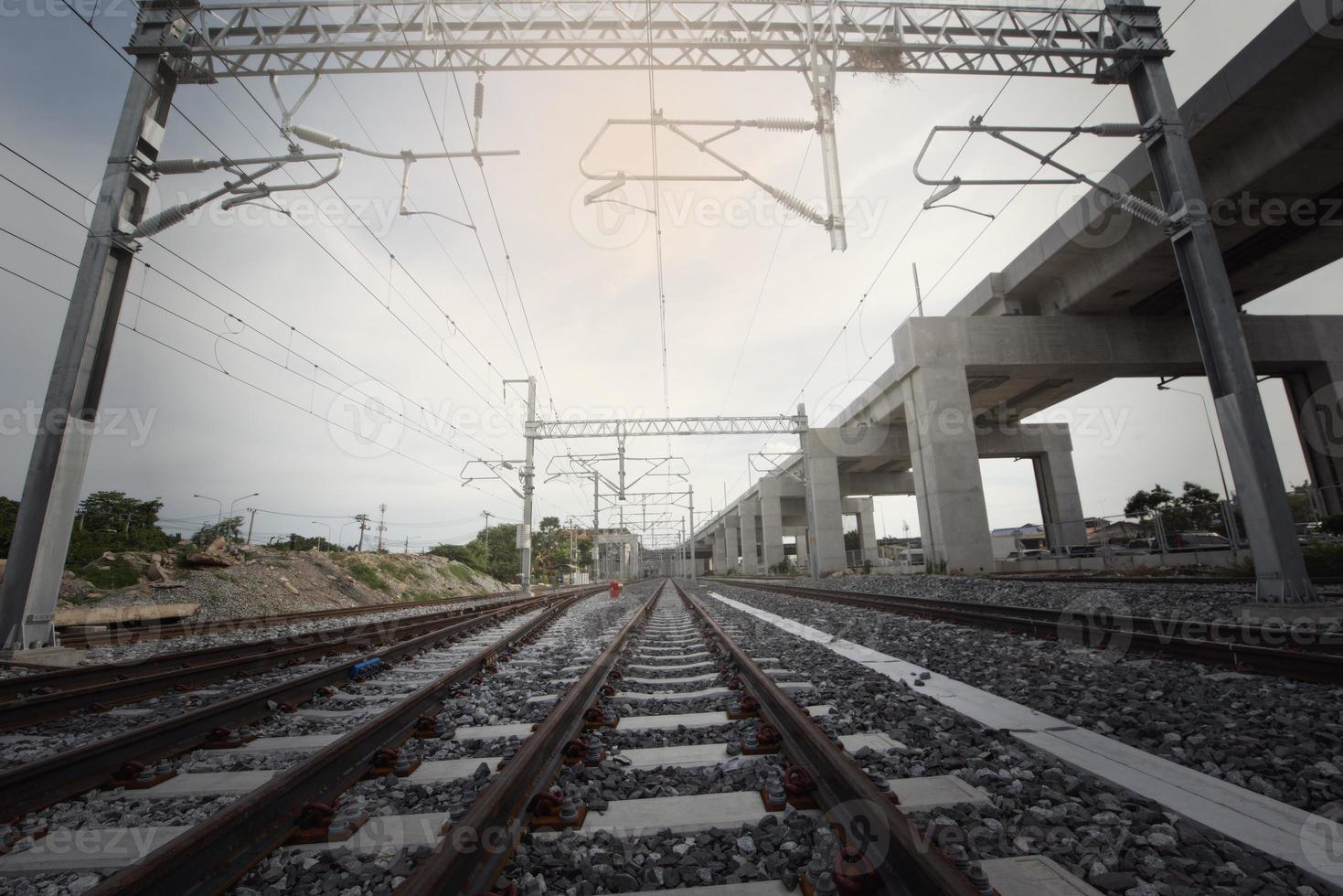 train tracks leading to the station photo