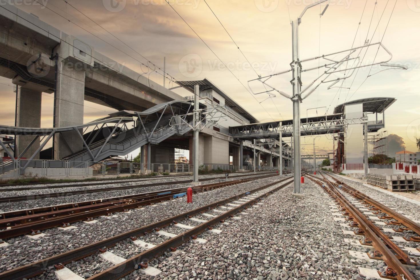 train tracks leading to the station photo