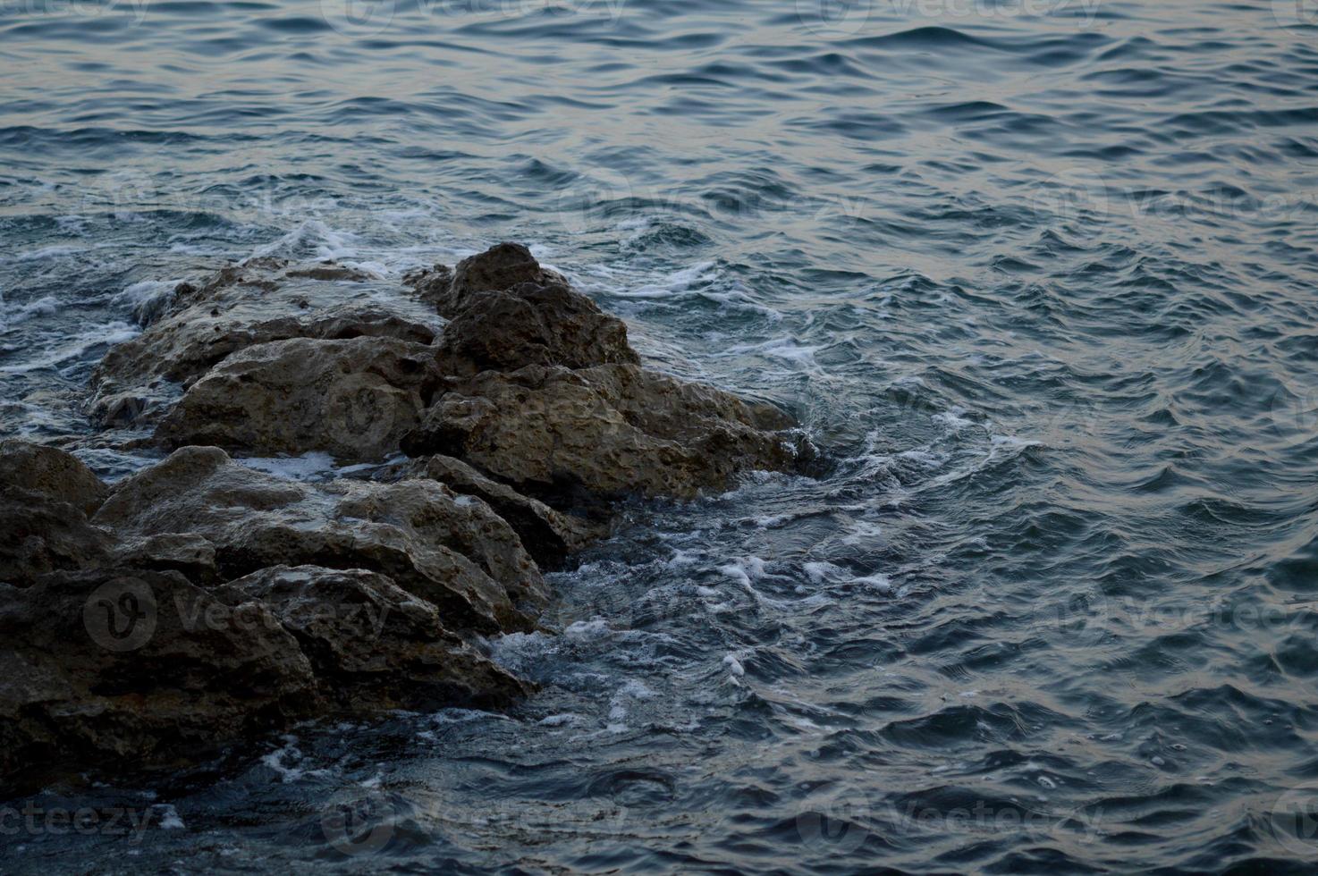 Croatia beach, rocks at the beach, sea water, waves photo