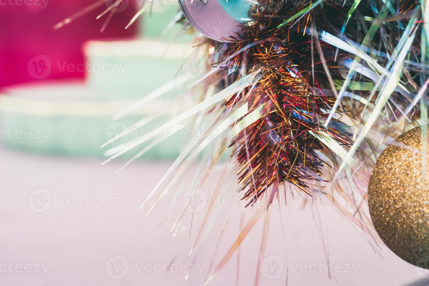 Christmas decoration with ribbon red and gold ball, space for writing. photo