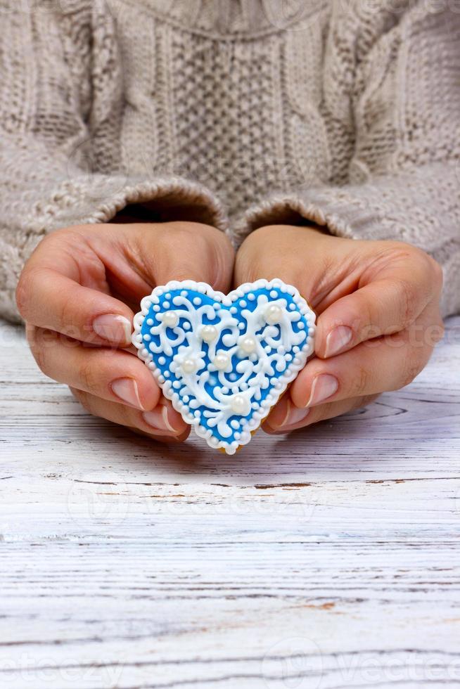 Heart cookies on hand, holiday cookies in hand photo