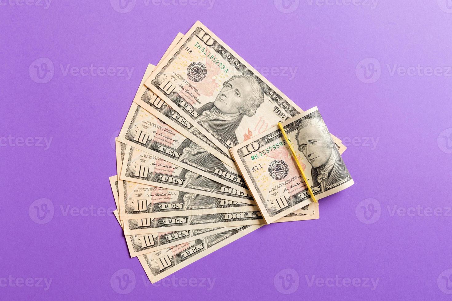 A Hundred dollar fan close up, Top view of business concept on colored background photo